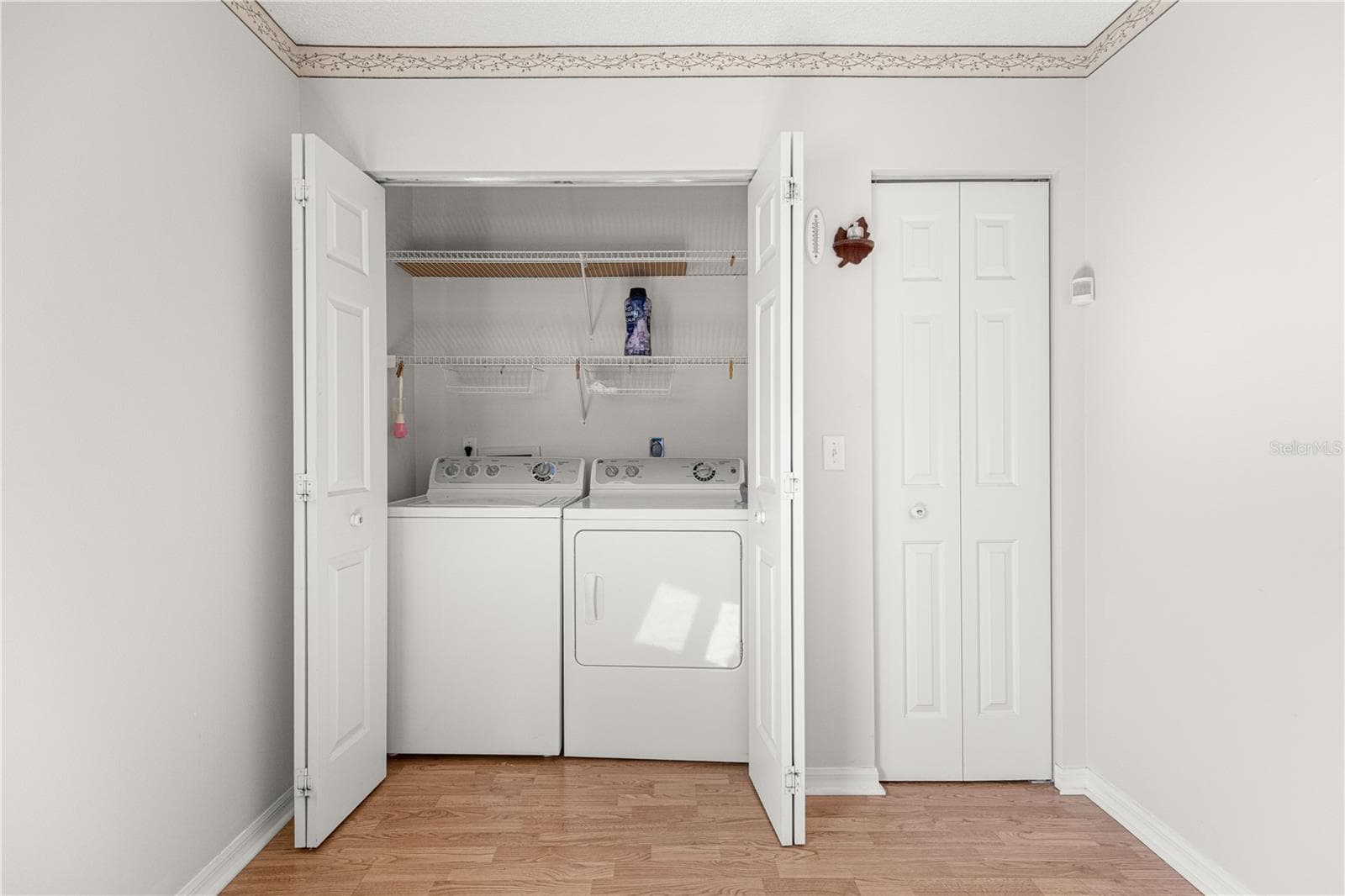 Washer and Dryer located in closet. Addtl storage closet to the right. - 6164 SW 84 LN, OCALA