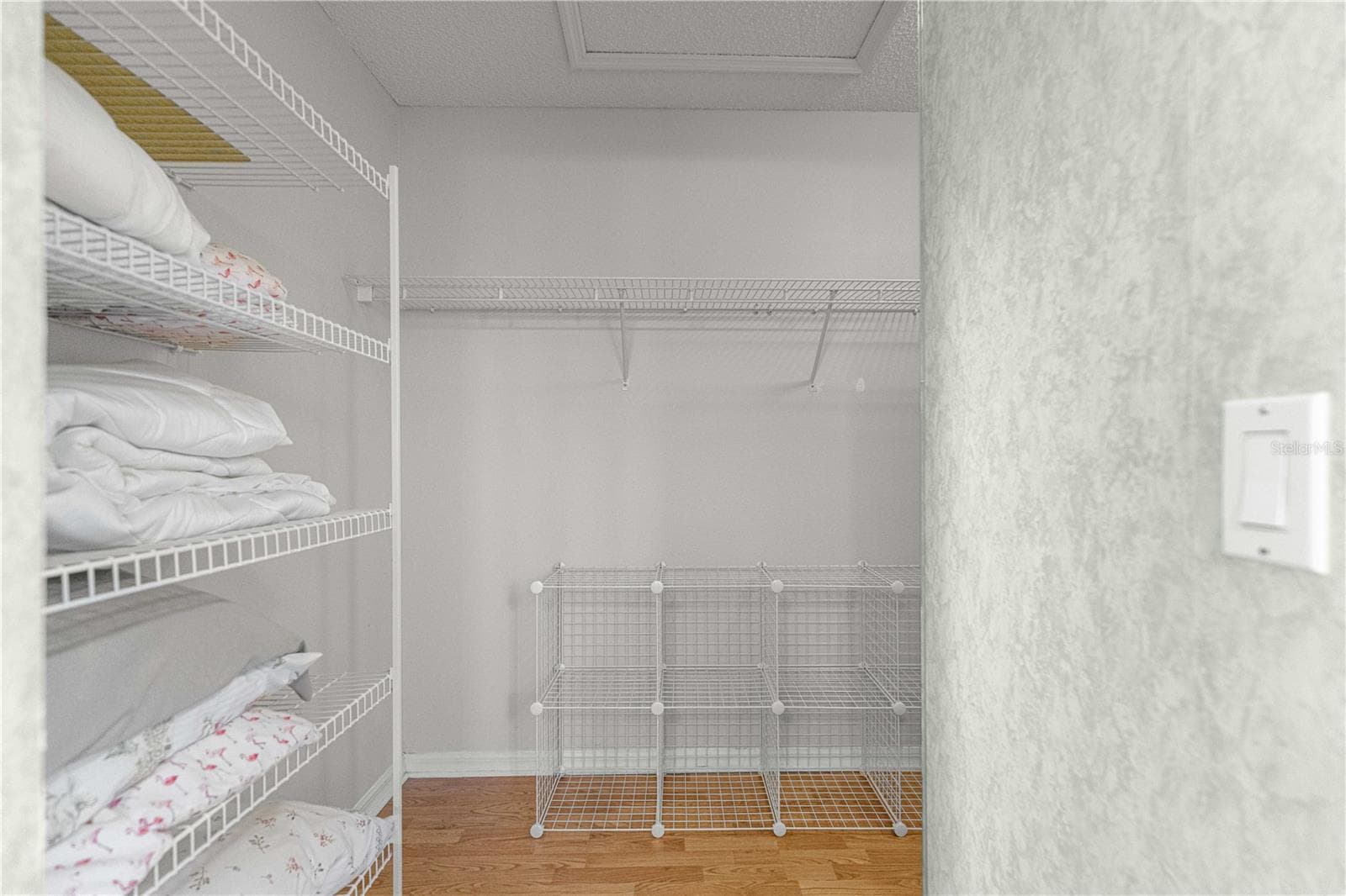 Walk in Closet includes plenty of organization and shelving. - 6164 SW 84 LN, OCALA