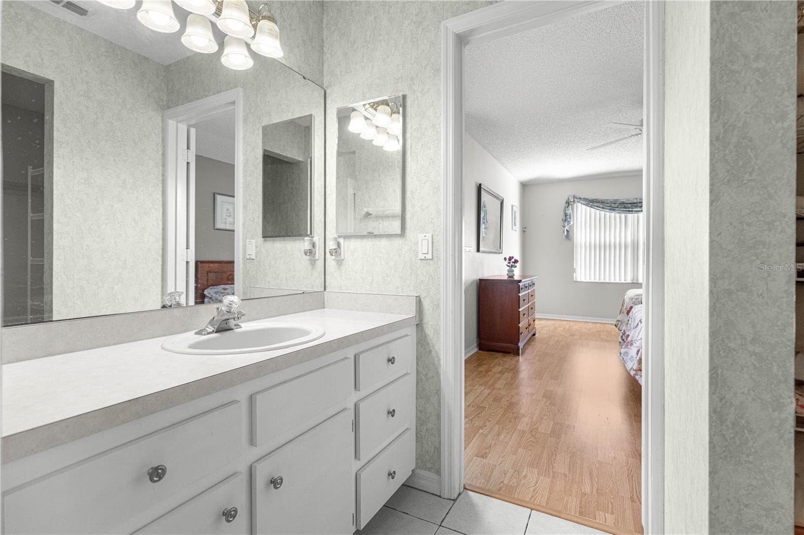 Walk in Closet includes plenty of organization and shelving. - 6164 SW 84 LN, OCALA