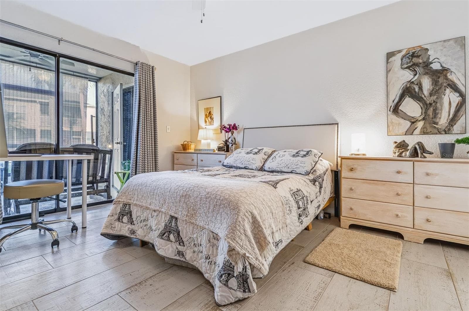 main bedroom with views of porch - 406 BOUCHELLE DR #103, NEW SMYRNA BEACH