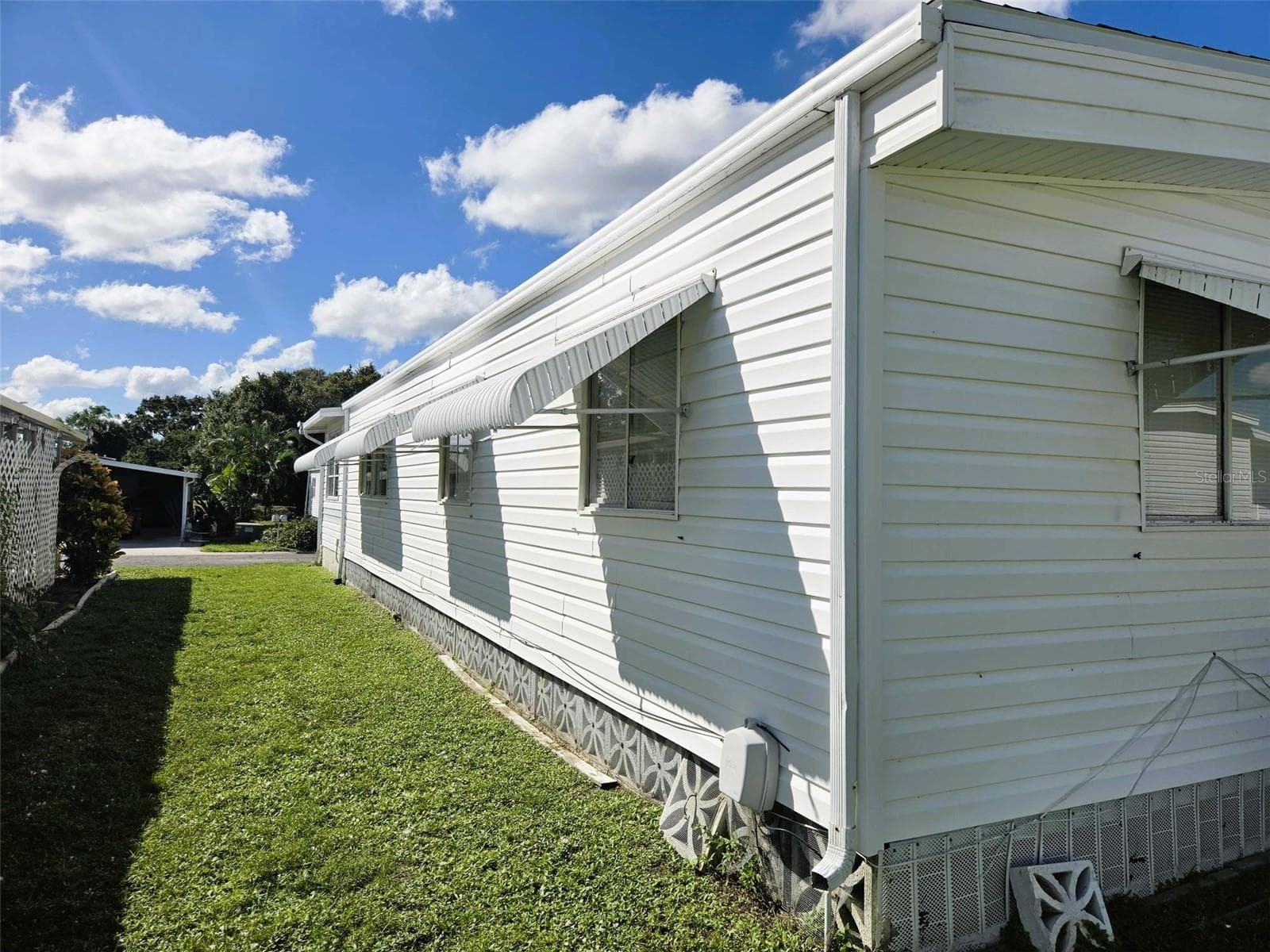 right side of home with shutters - 3309 OAKWOOD BLVD S, SARASOTA