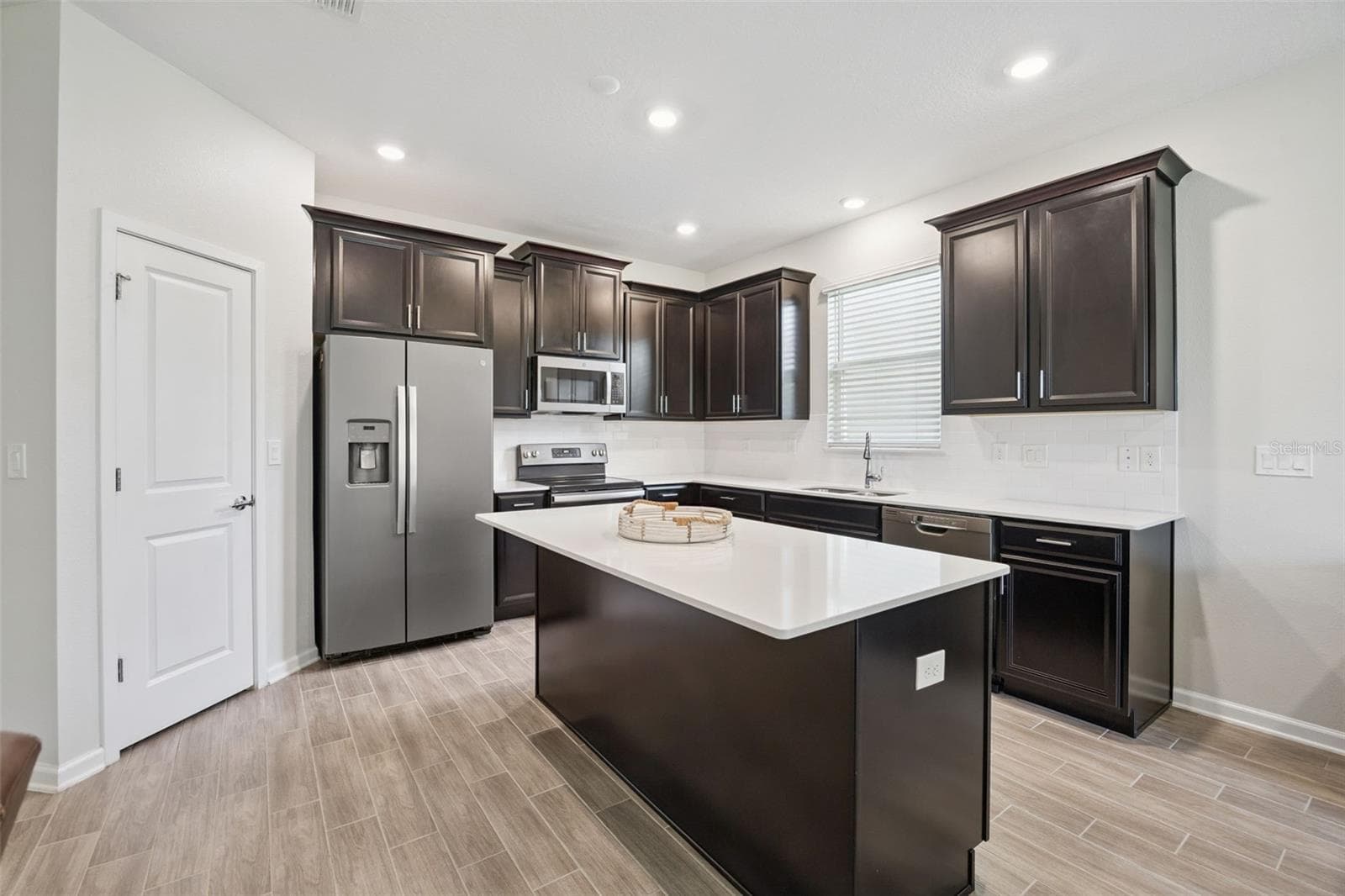 View of Kitchen with Ample Lighting - 5309 AMERSHAM LN, ST CLOUD