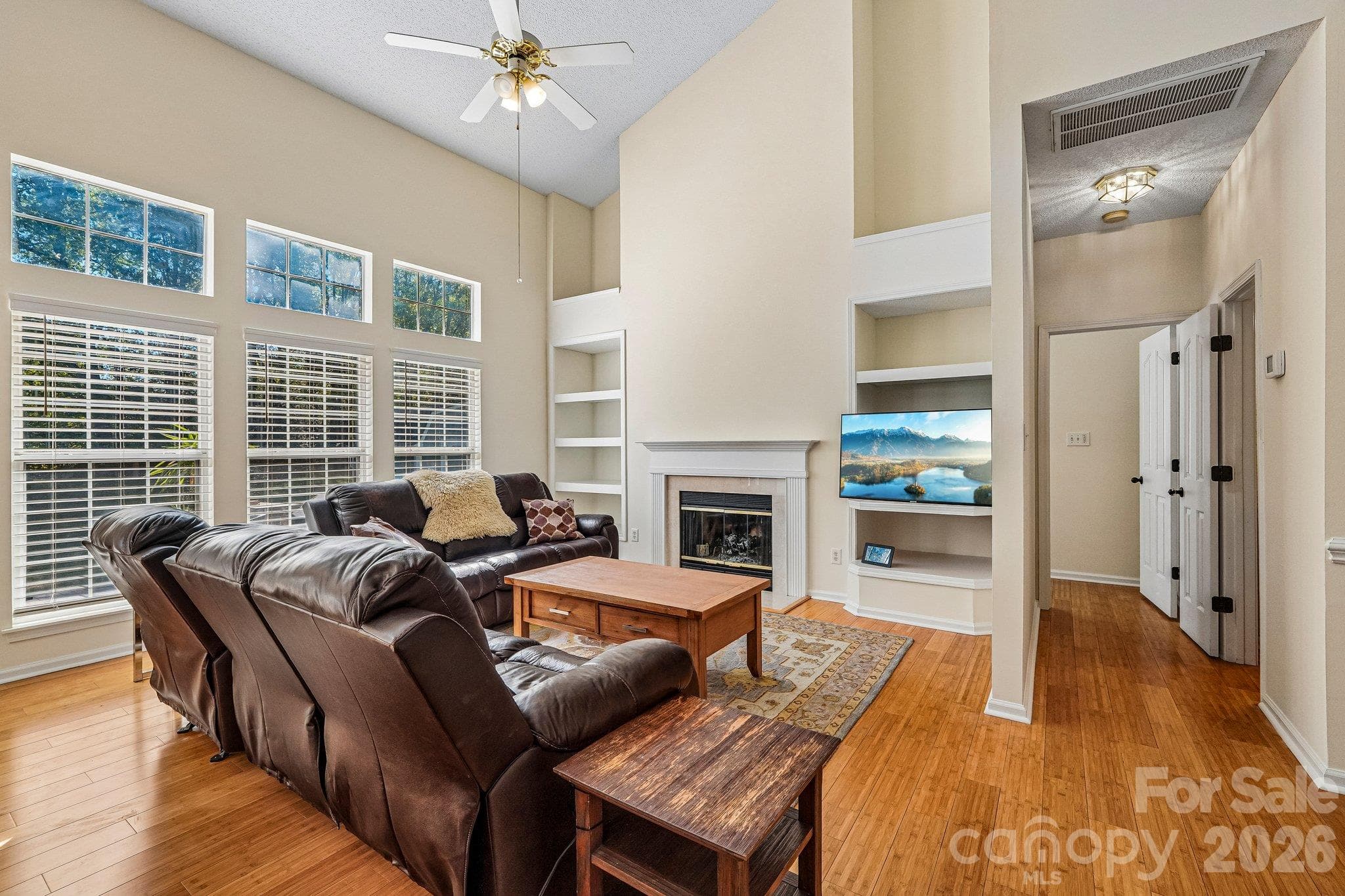 Spacious living room with vaulted ceilings and fireplace - 11207 Livingston Mill Road, Charlotte