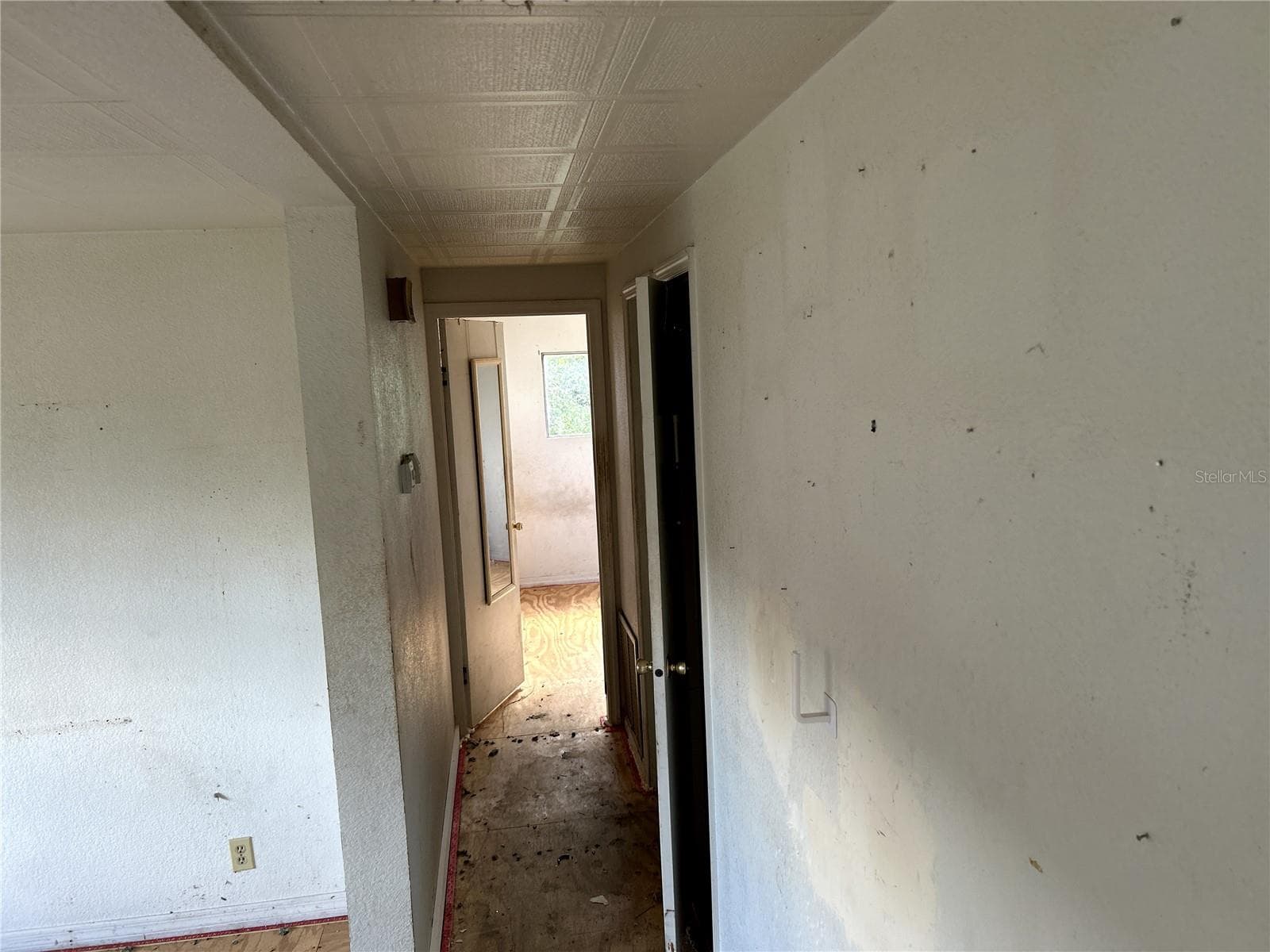 view down hall into primary bedroom - 14506 DEHAVEN AVE, BROOKSVILLE