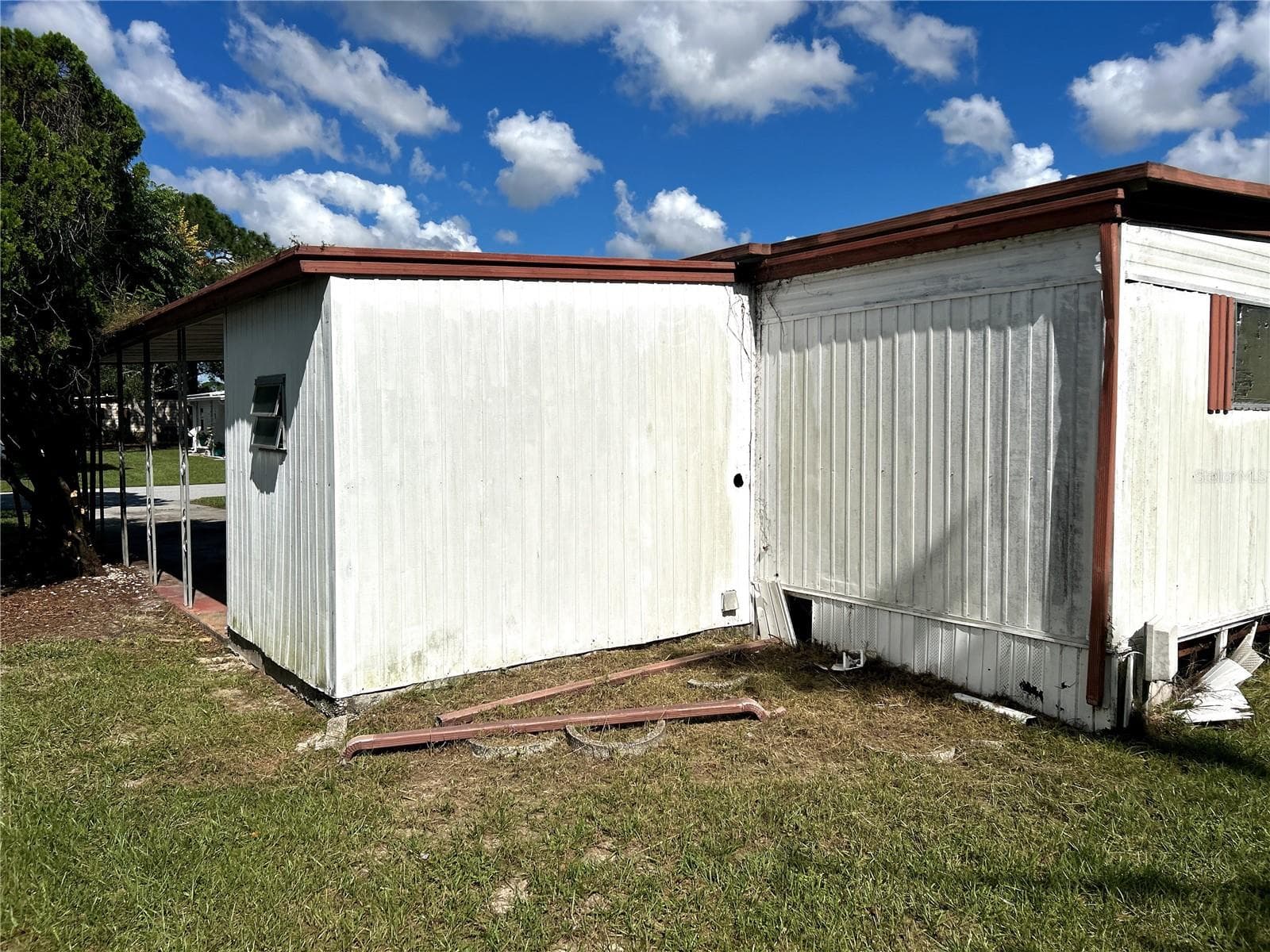 back view of utility/ laundry room and primary bedroom. - 14506 DEHAVEN AVE, BROOKSVILLE