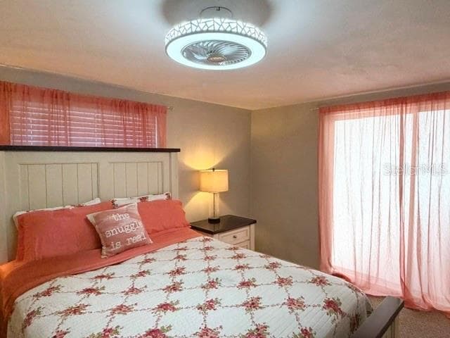 Primary Bedroom *Slider to back porch - 7910 ILEX DR, PORT RICHEY