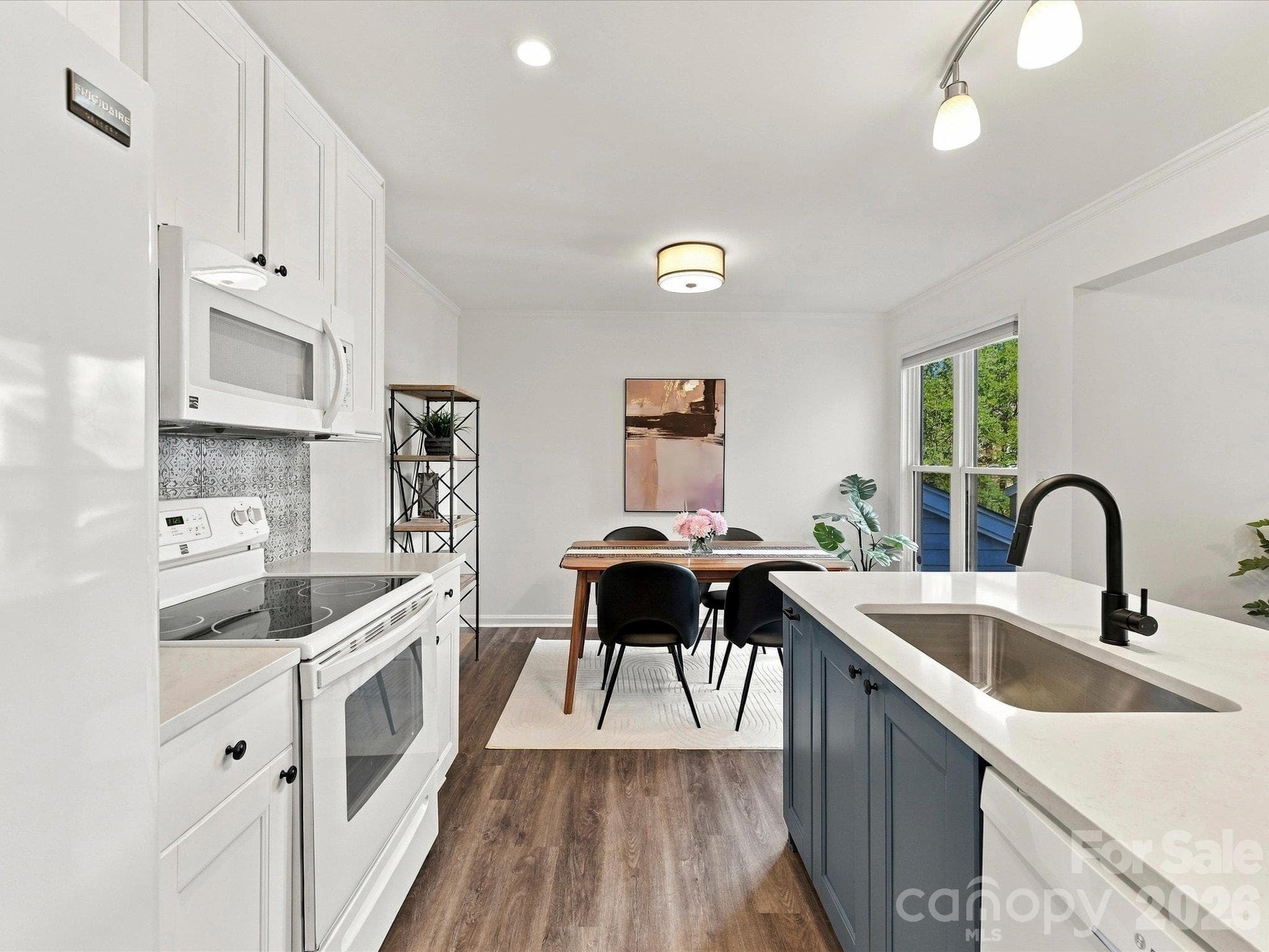 Kitchen with new quartz countertops, undermount sink and faucet - 423 W 8th Street, Charlotte