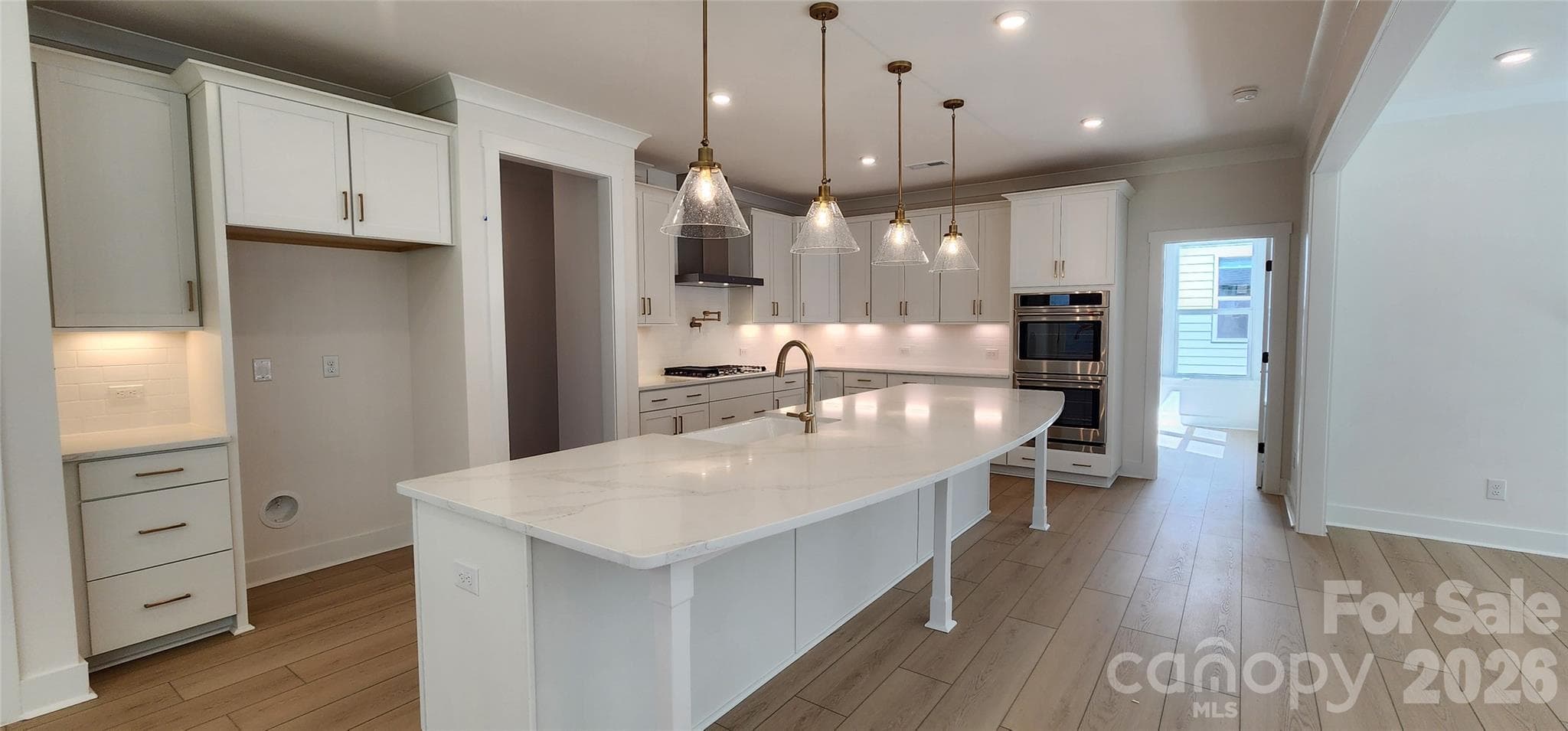 Gourmet kitchen with double ovens and 20 foot island - 577 Cottage Garden Lane, Belmont
