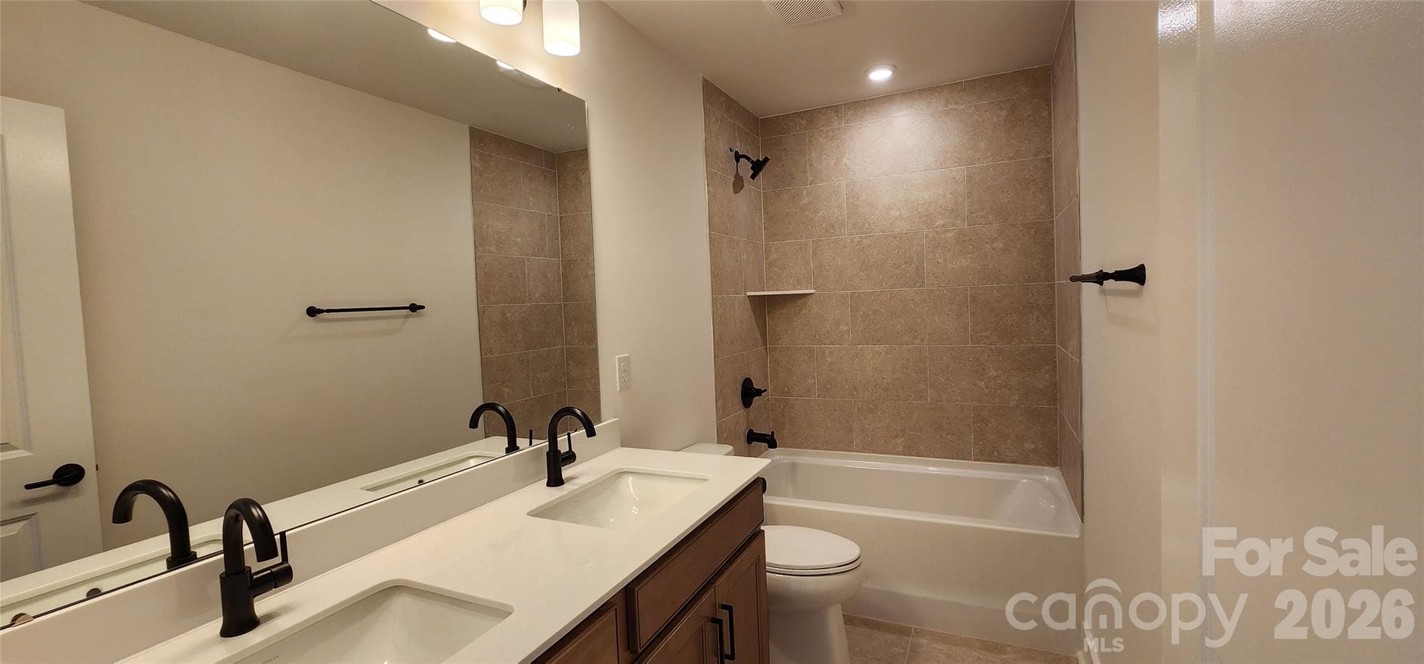 Secondary bathroom with tile surround tub - 577 Cottage Garden Lane, Belmont