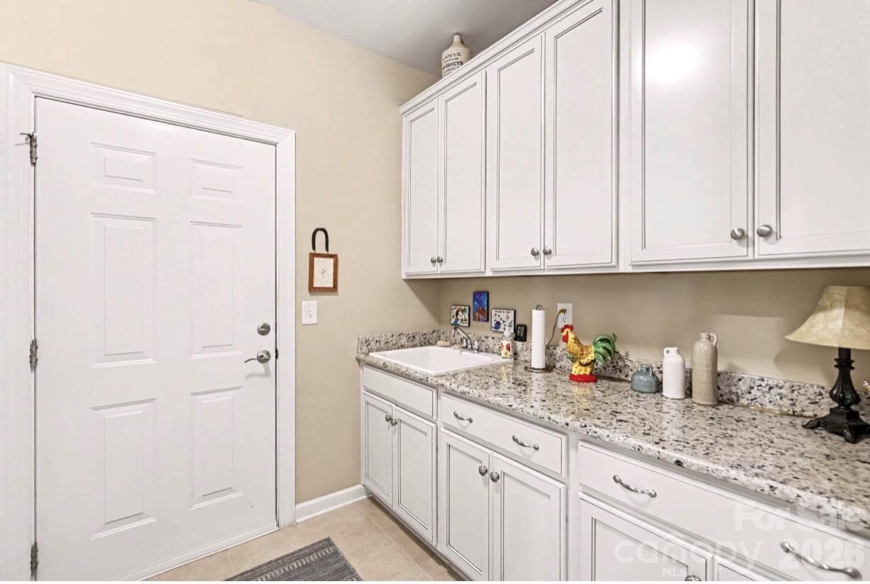 Utility Sink and Extra Cabinets in Laundry Room - 1567 Tranquility Boulevard, Lancaster