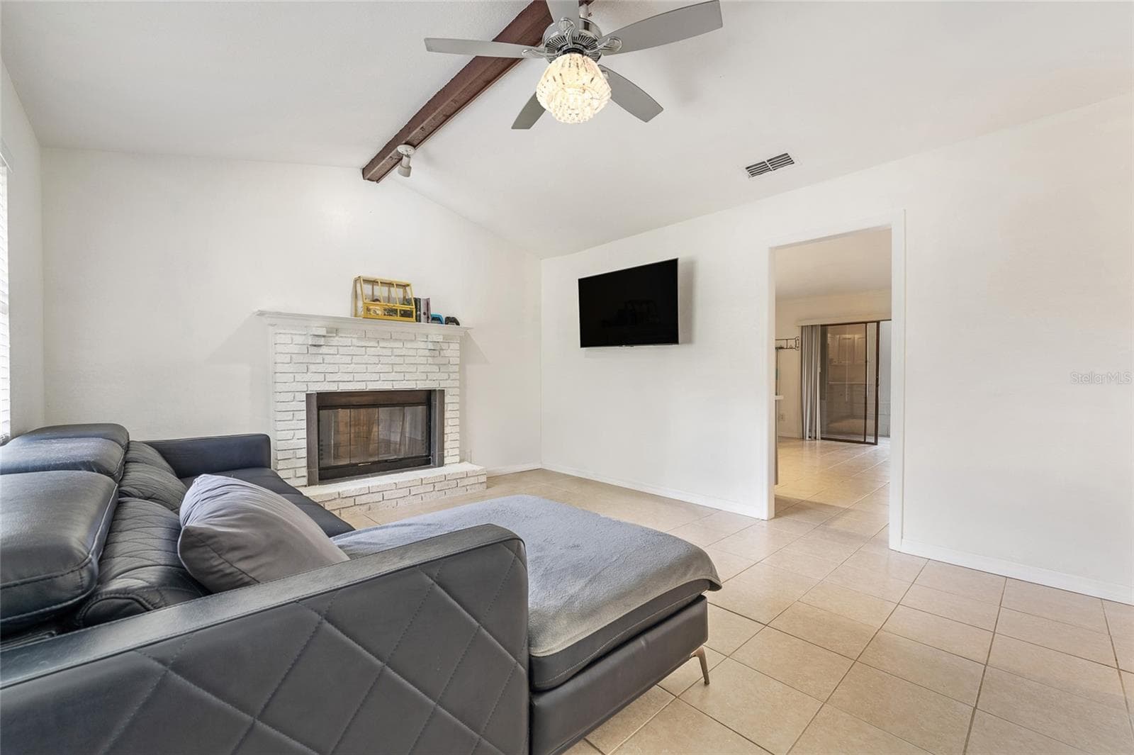 Living room with wood burning fireplace. - 2040 E TRIANGLE DR, LONGWOOD