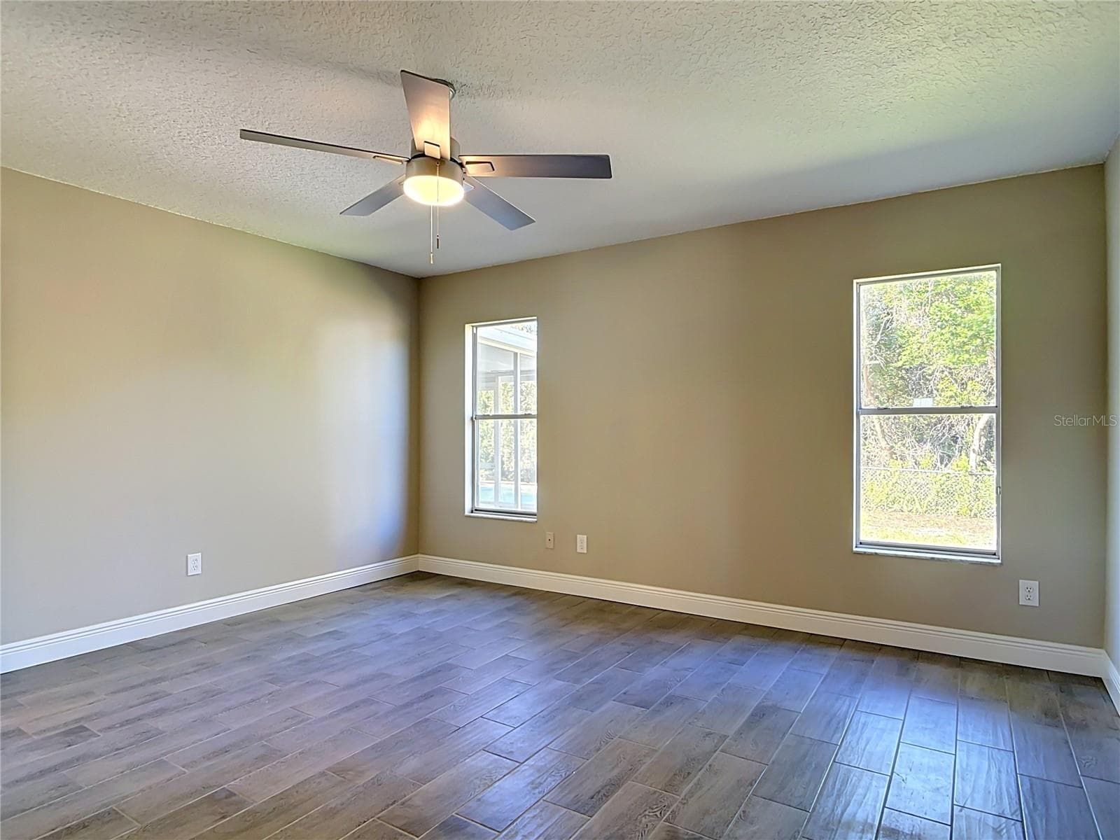Primary bedroom. - 3025 FOXBORO CIR, DELTONA