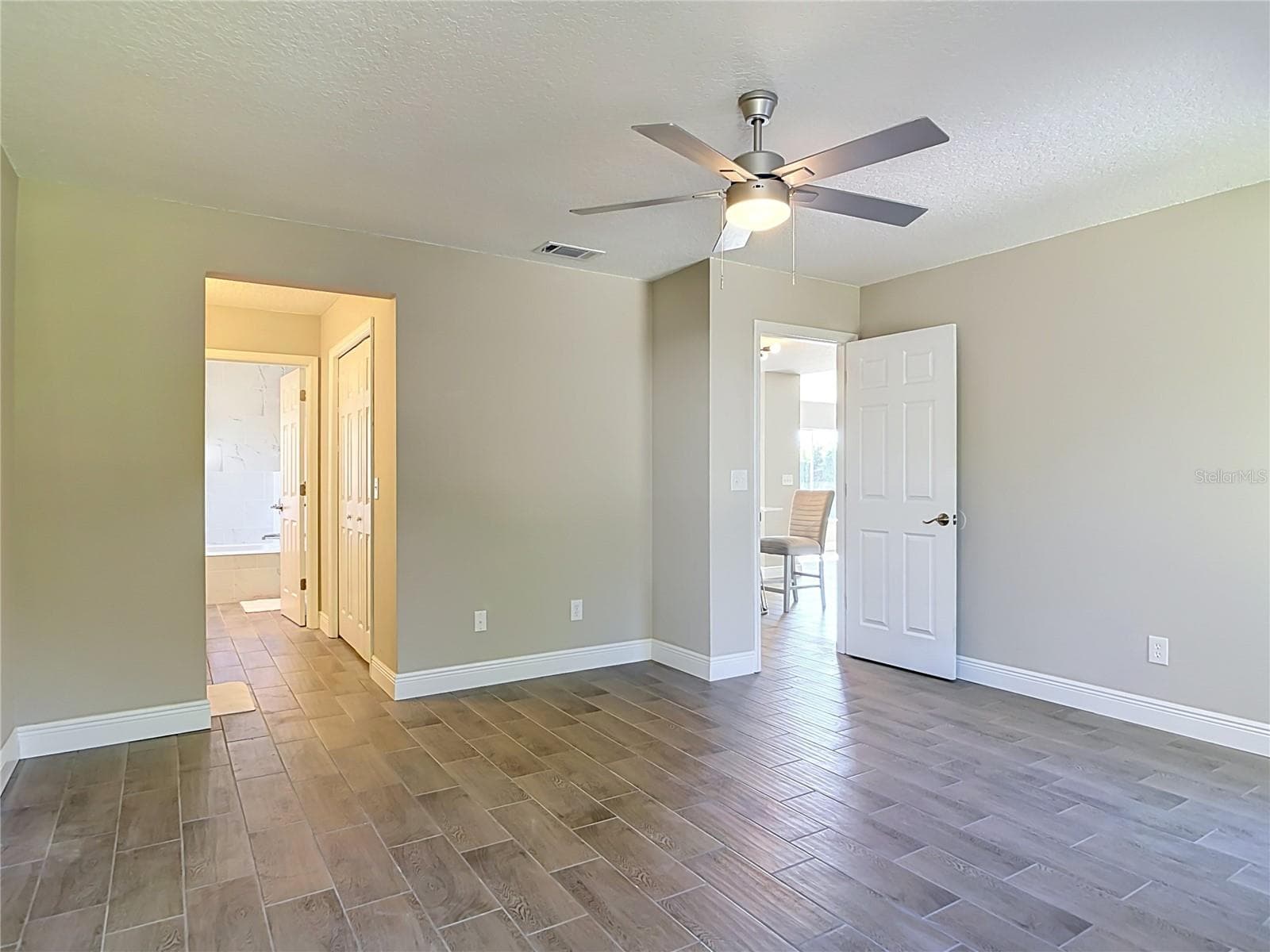 Primary bedroom. - 3025 FOXBORO CIR, DELTONA