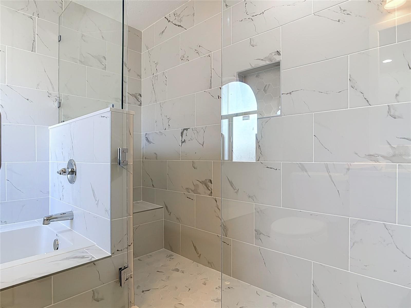 Primary bathroom with tub and shower. - 3025 FOXBORO CIR, DELTONA