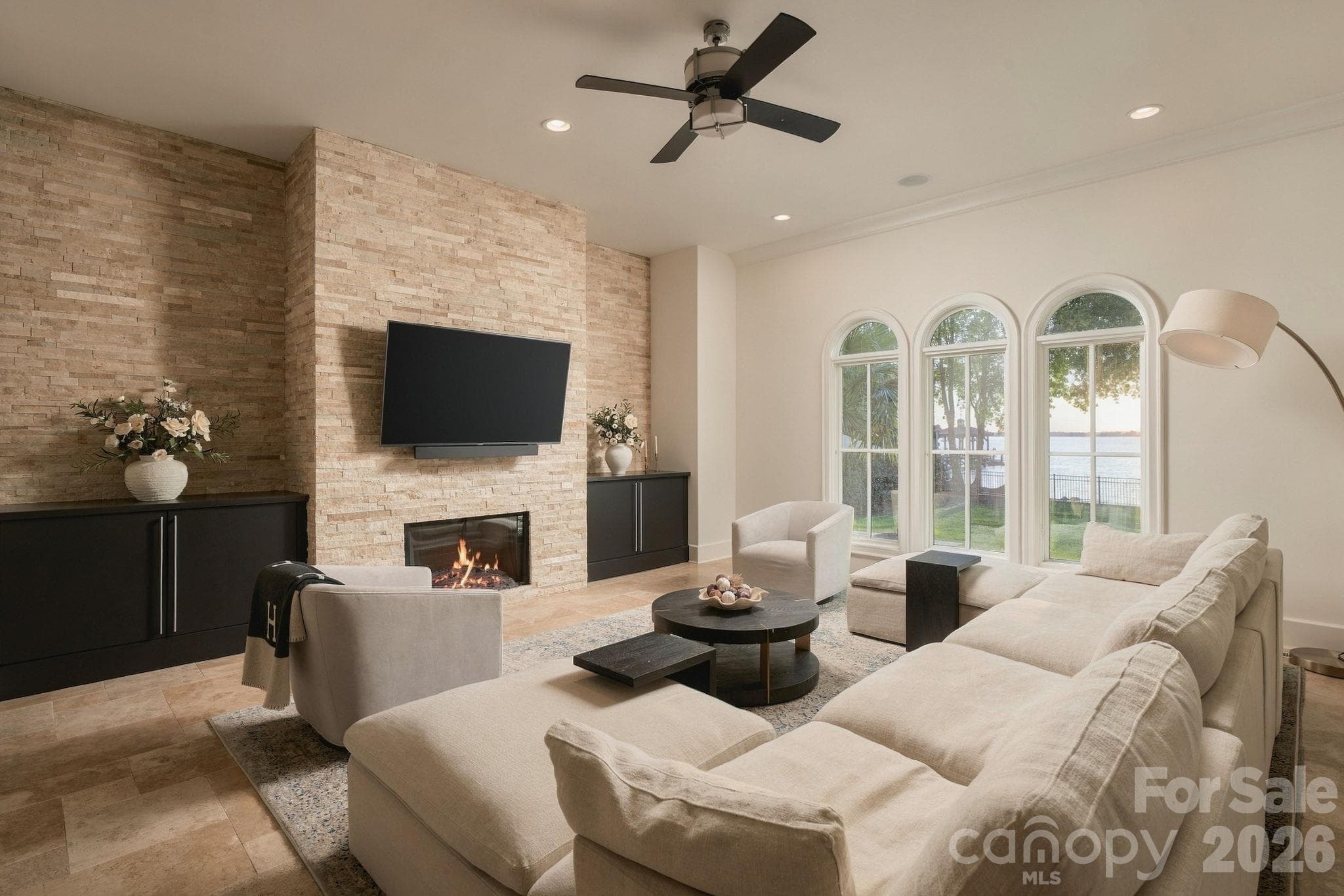 Great room with fireplace and endless views of the lake! - 21215 Senlac Lane, Cornelius