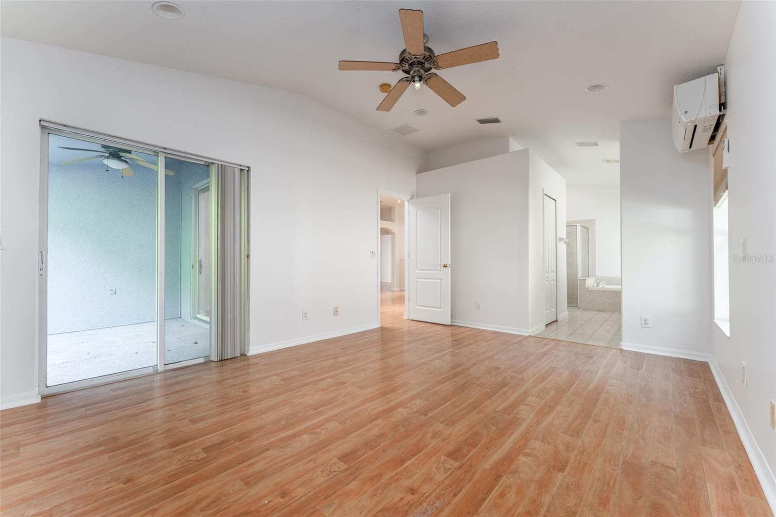 Sliding glass doors to back patio in primary - 1127 ROLLING STONE RUN, ODESSA