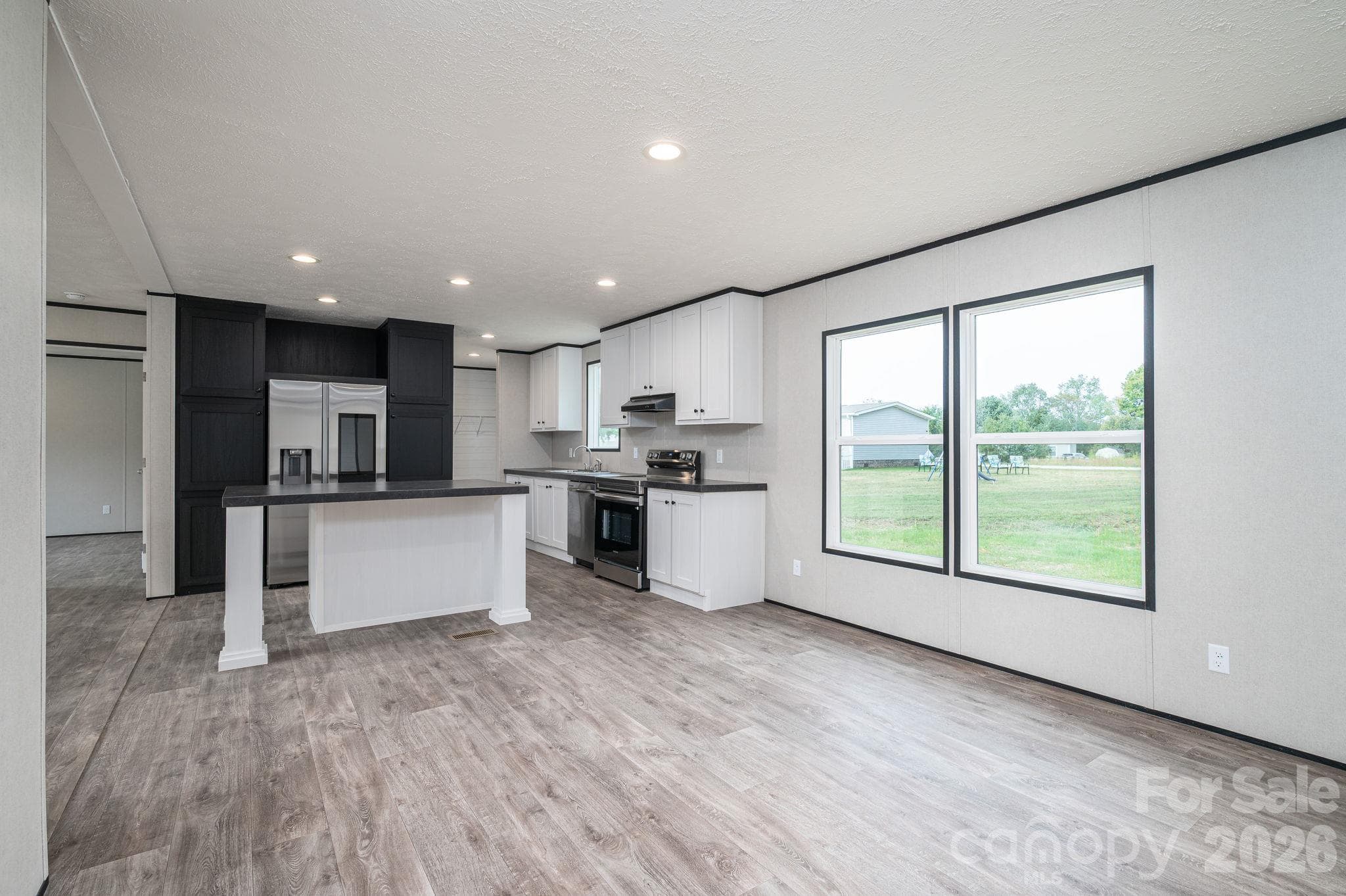 View from Living Room looking back into Kitchen area - 207 Grassy Field Court, Lawndale