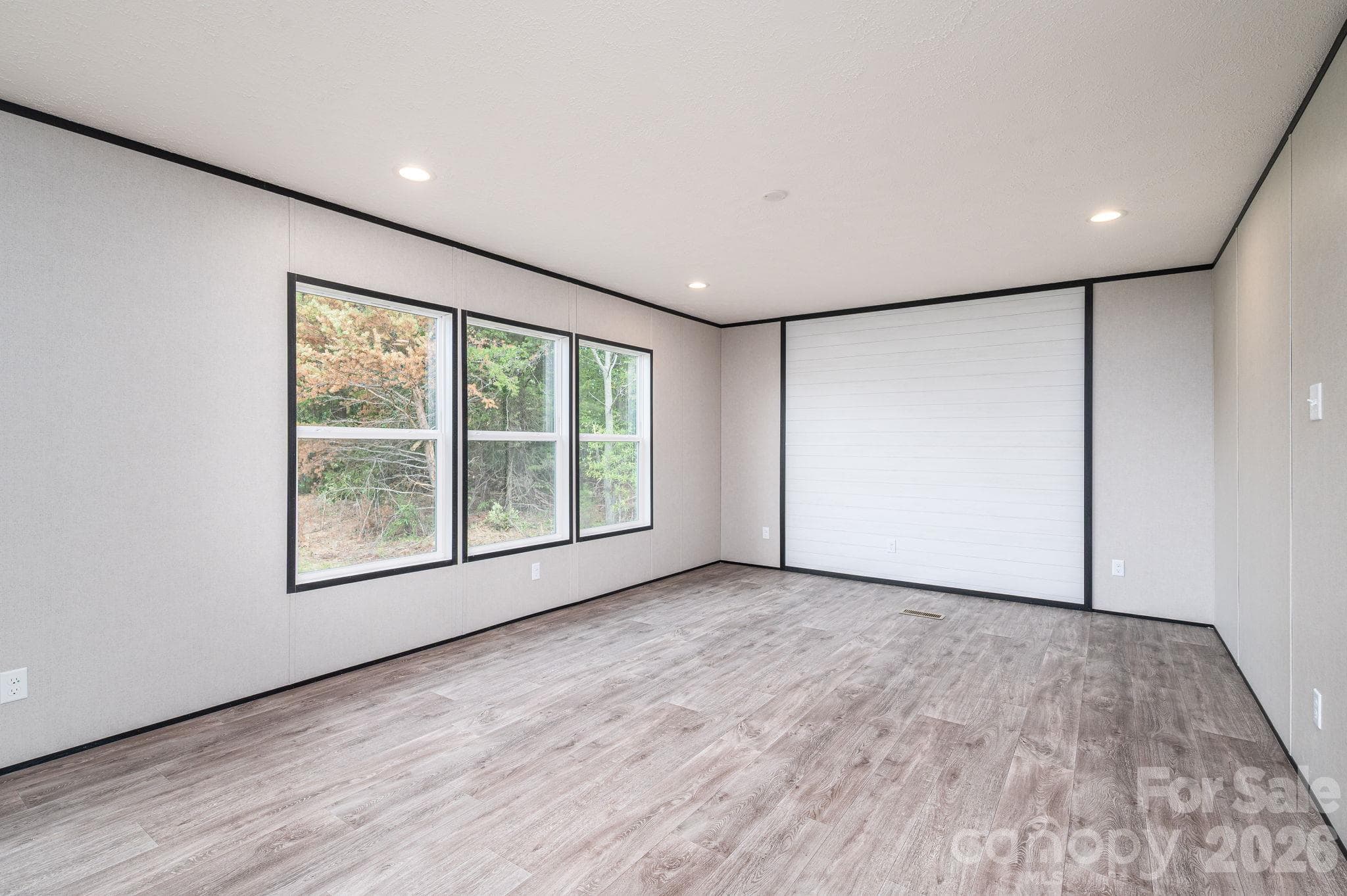 Living Room with accent shiplap wall - 207 Grassy Field Court, Lawndale