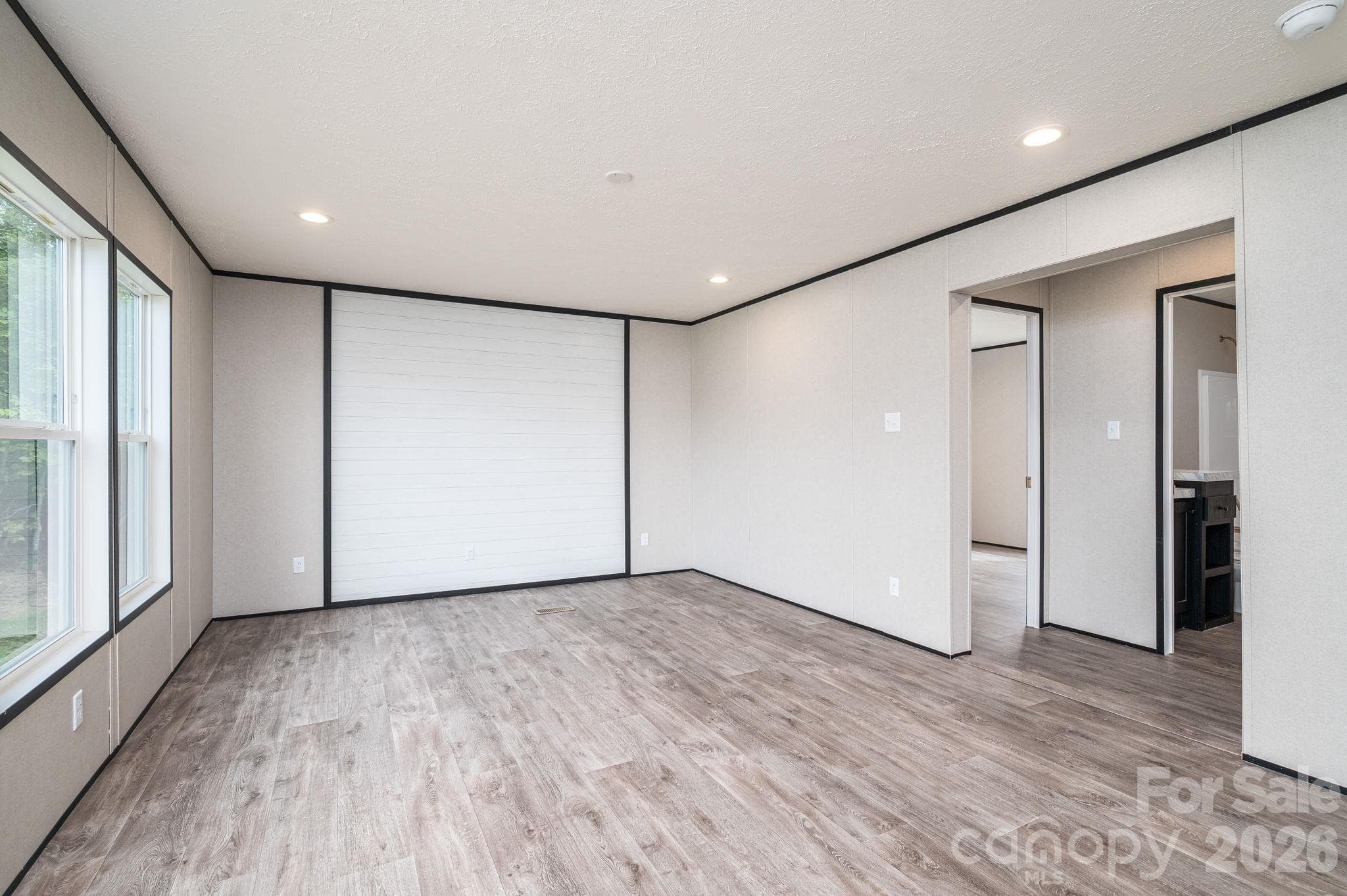 Off of the living room are the two bedrooms and the guest bath - 207 Grassy Field Court, Lawndale
