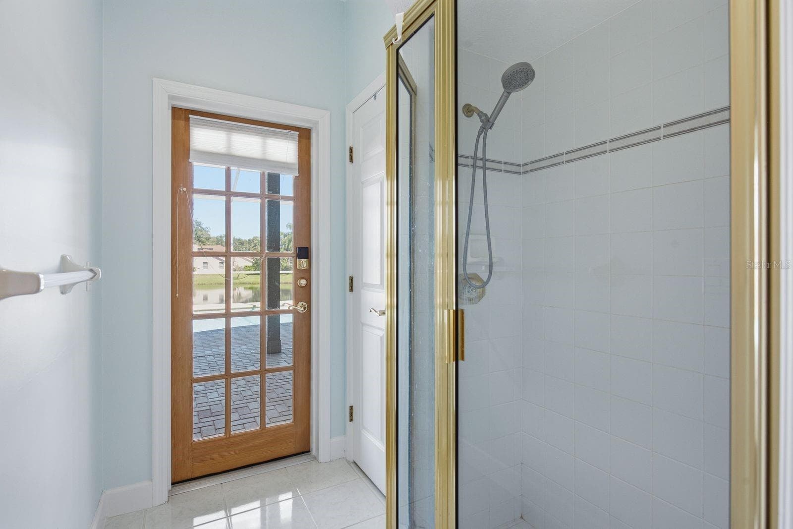 Shower and door to Lanai - 3763 EXECUTIVE DR, PALM HARBOR