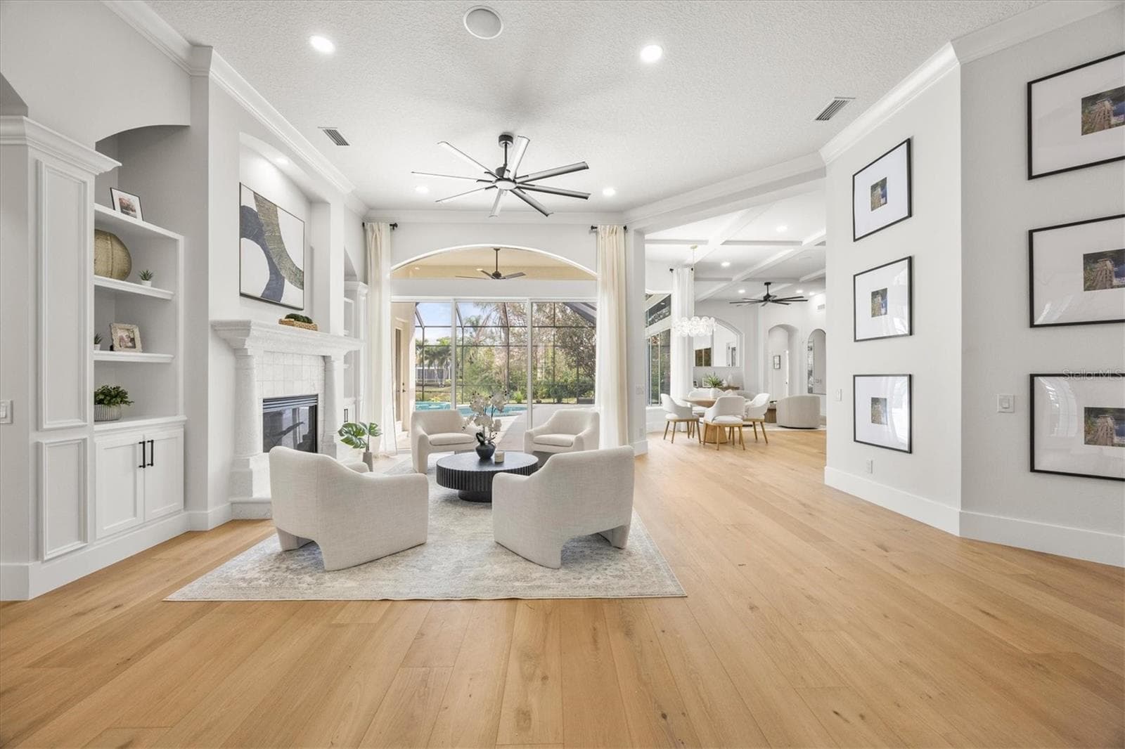 Living Room, Gas Fireplace, Built-ins and White Oak Engineered Wood Flooring - 6922 STANHOPE PL, UNIVERSITY PARK
