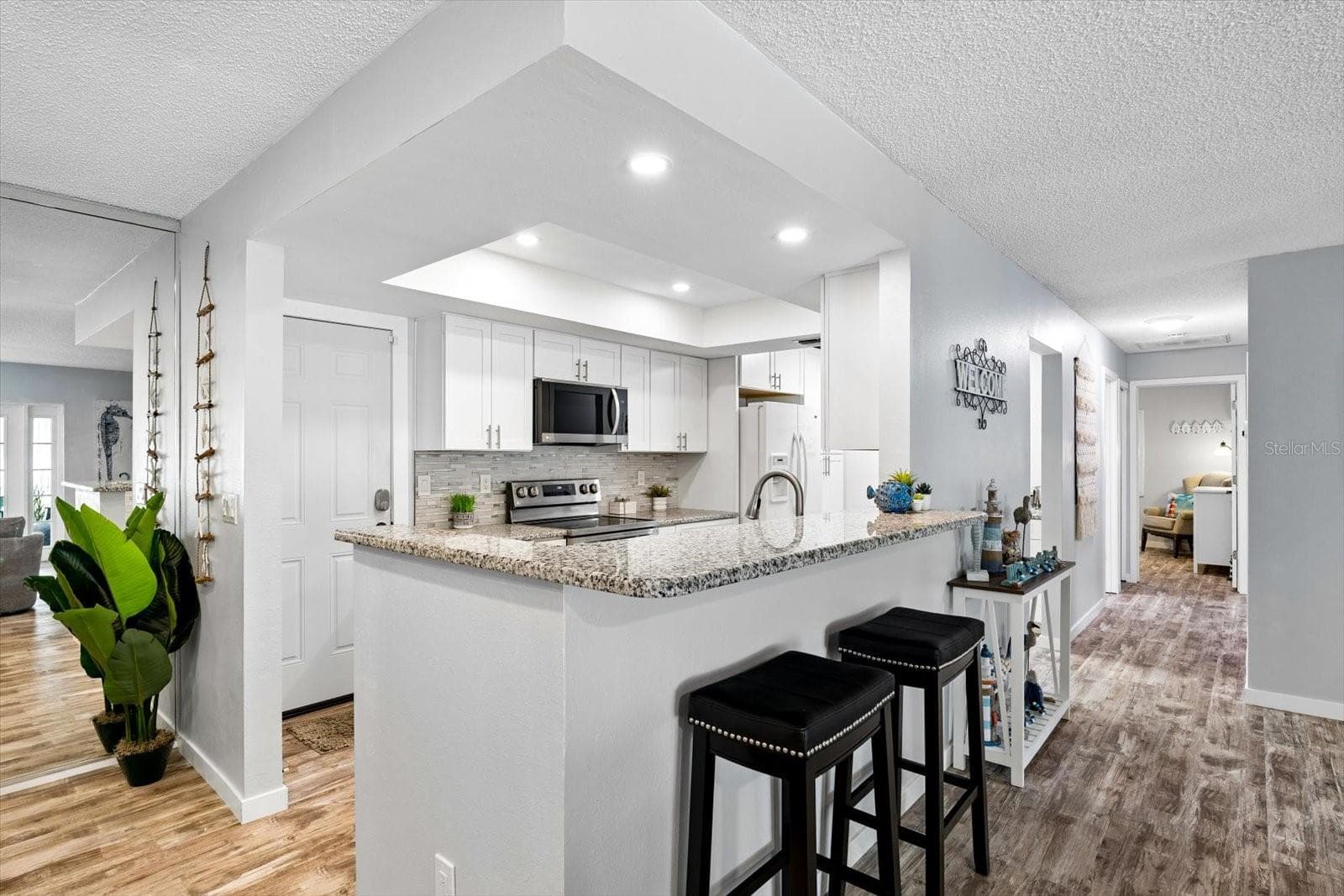 Open concept kitchen with bar - 1307 STONEHAVEN LN, DUNEDIN