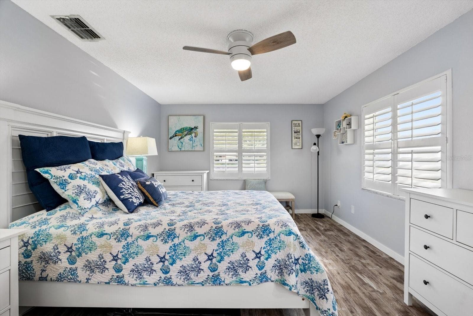Primary bedroom with plantation shutters. - 1307 STONEHAVEN LN, DUNEDIN