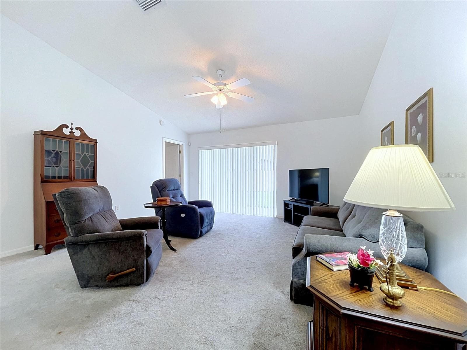 Open floor plan with sliding glass doors - 27408 CORAL SPRINGS DR, WESLEY CHAPEL