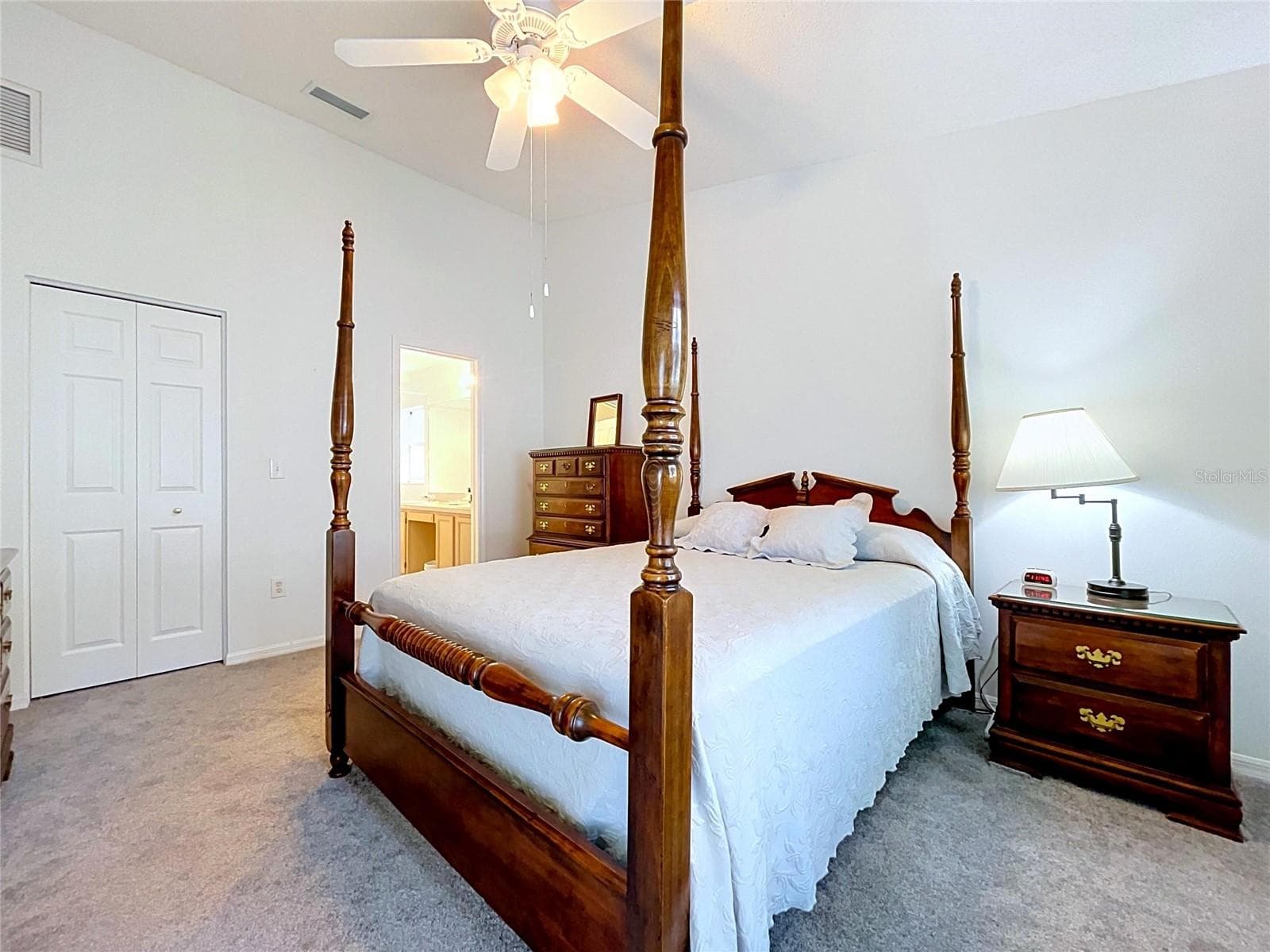 Walk-in closet and entry to Master Bath - 27408 CORAL SPRINGS DR, WESLEY CHAPEL