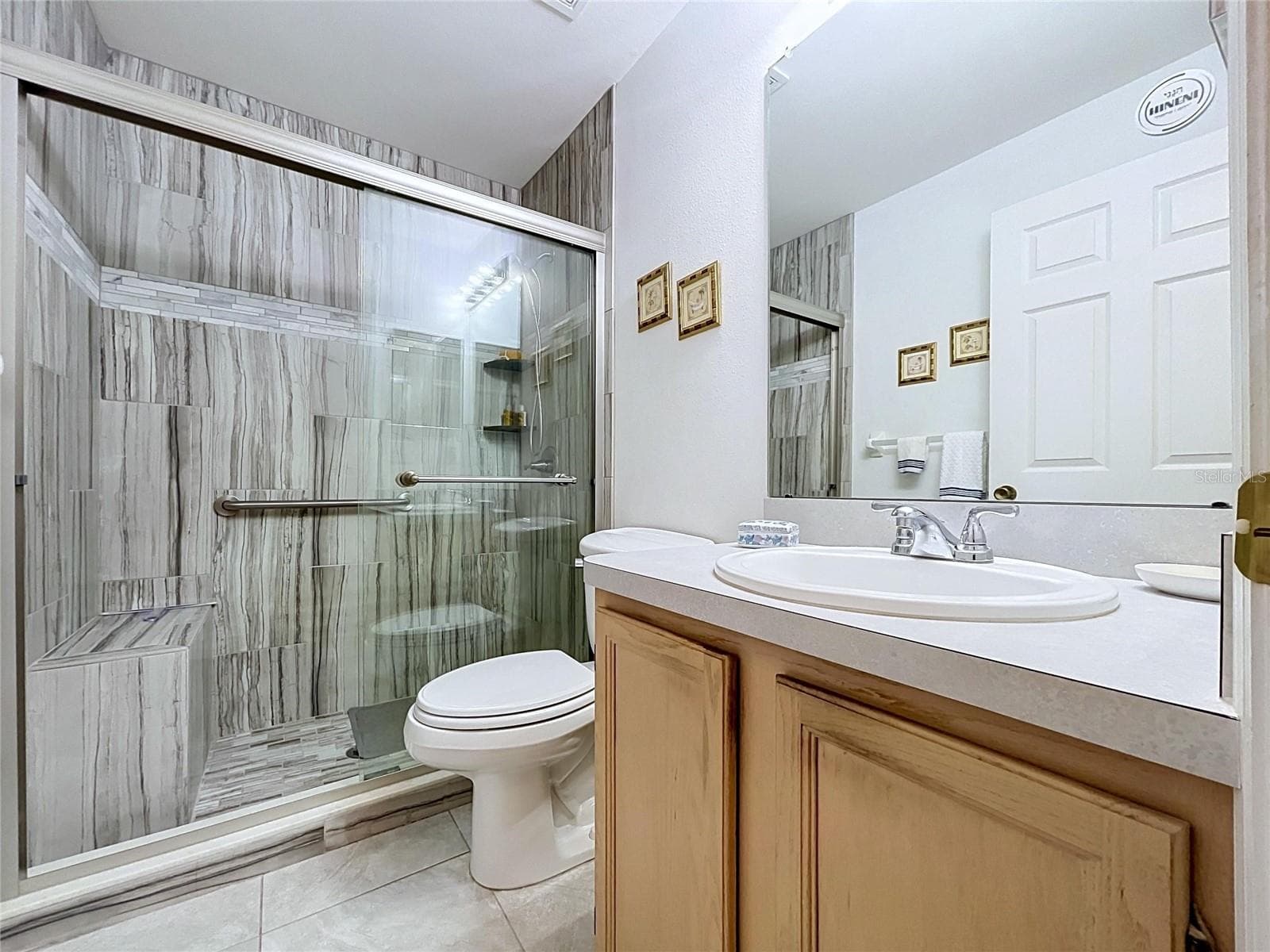 Gorgeous, remodeled shower and tile floor - 27408 CORAL SPRINGS DR, WESLEY CHAPEL