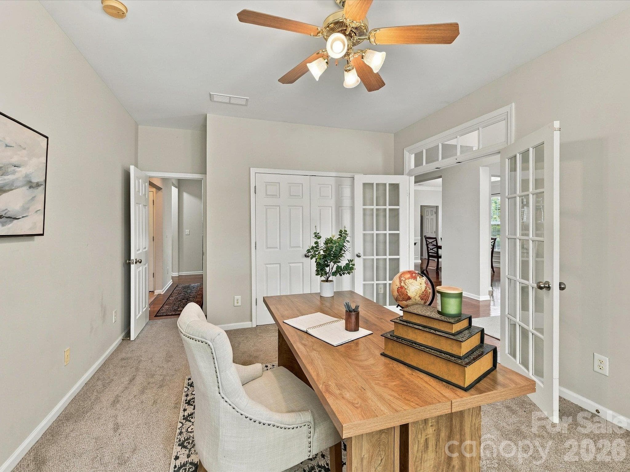 French doors open to a versatile flex space filled with natural light, offering the perfect setting for a home office, library, sitting room, or study. - 1788 Oakmont Drive, Denver