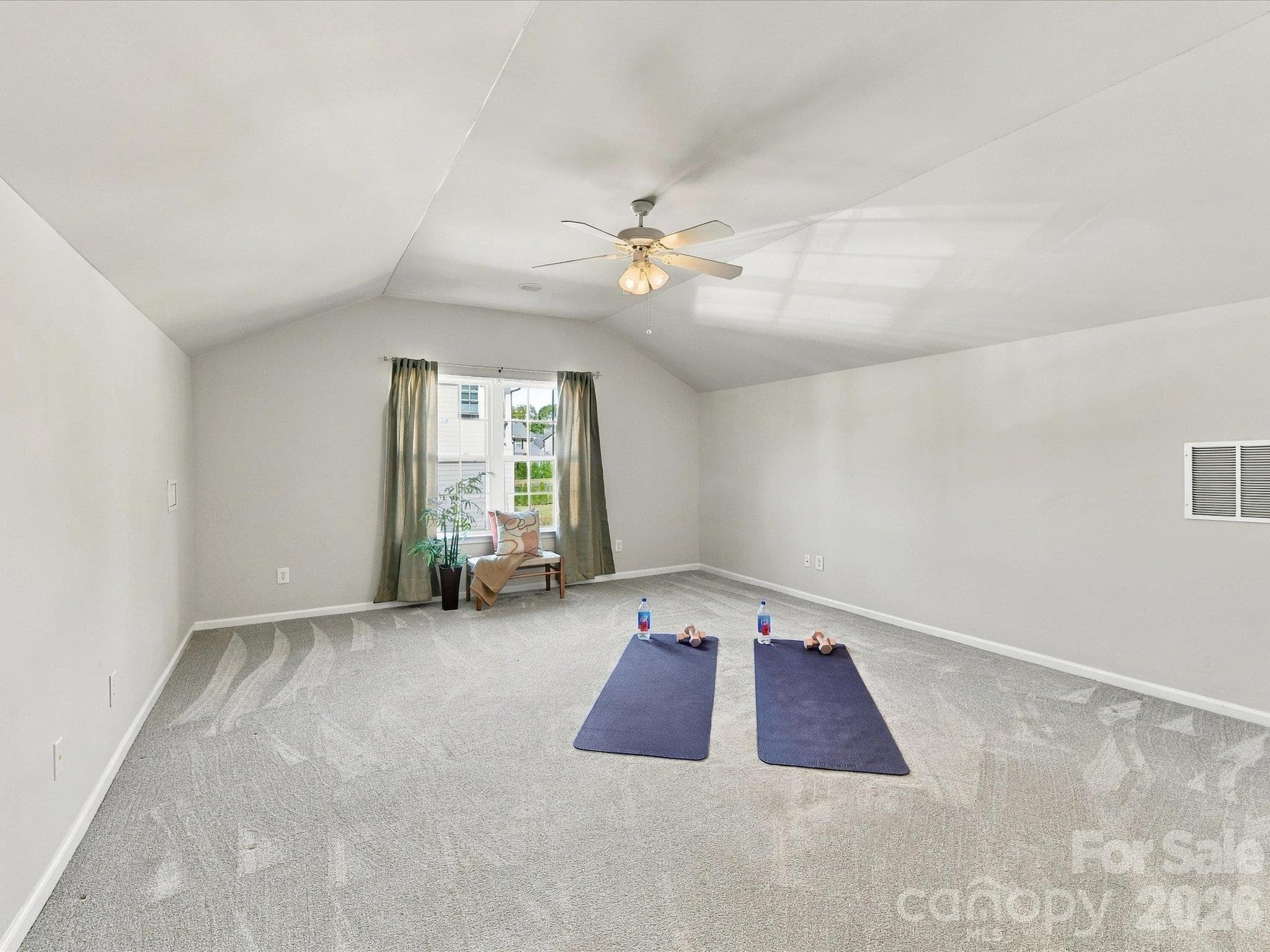 Expansive bonus room with vaulted ceilings and endless flexibility, offering the perfect space for a media room, playroom, home gym, or additional living area. - 1788 Oakmont Drive, Denver