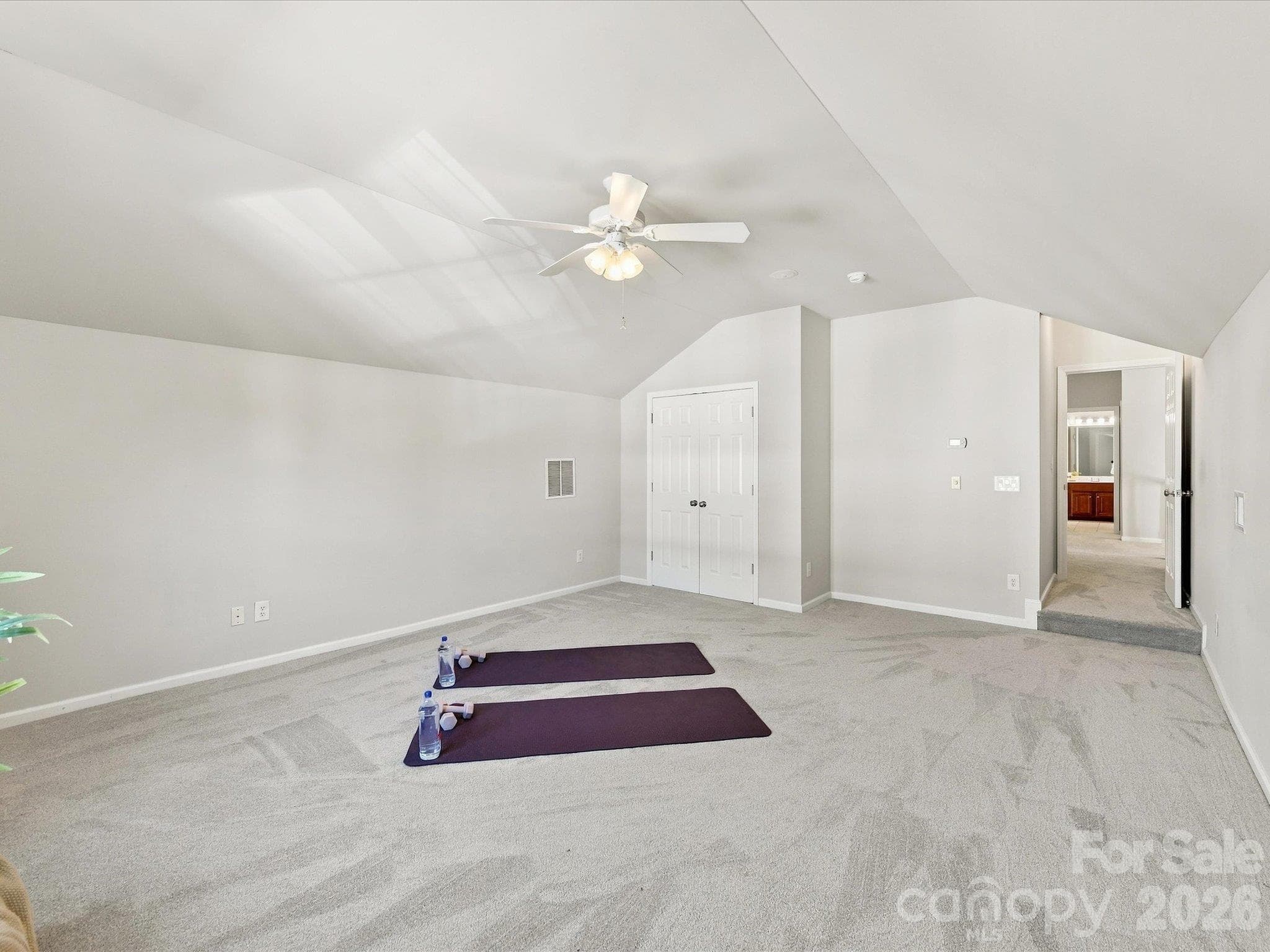 Expansive bonus room with vaulted ceilings and endless flexibility, offering the perfect space for a media room, playroom, home gym, or additional living area. - 1788 Oakmont Drive, Denver