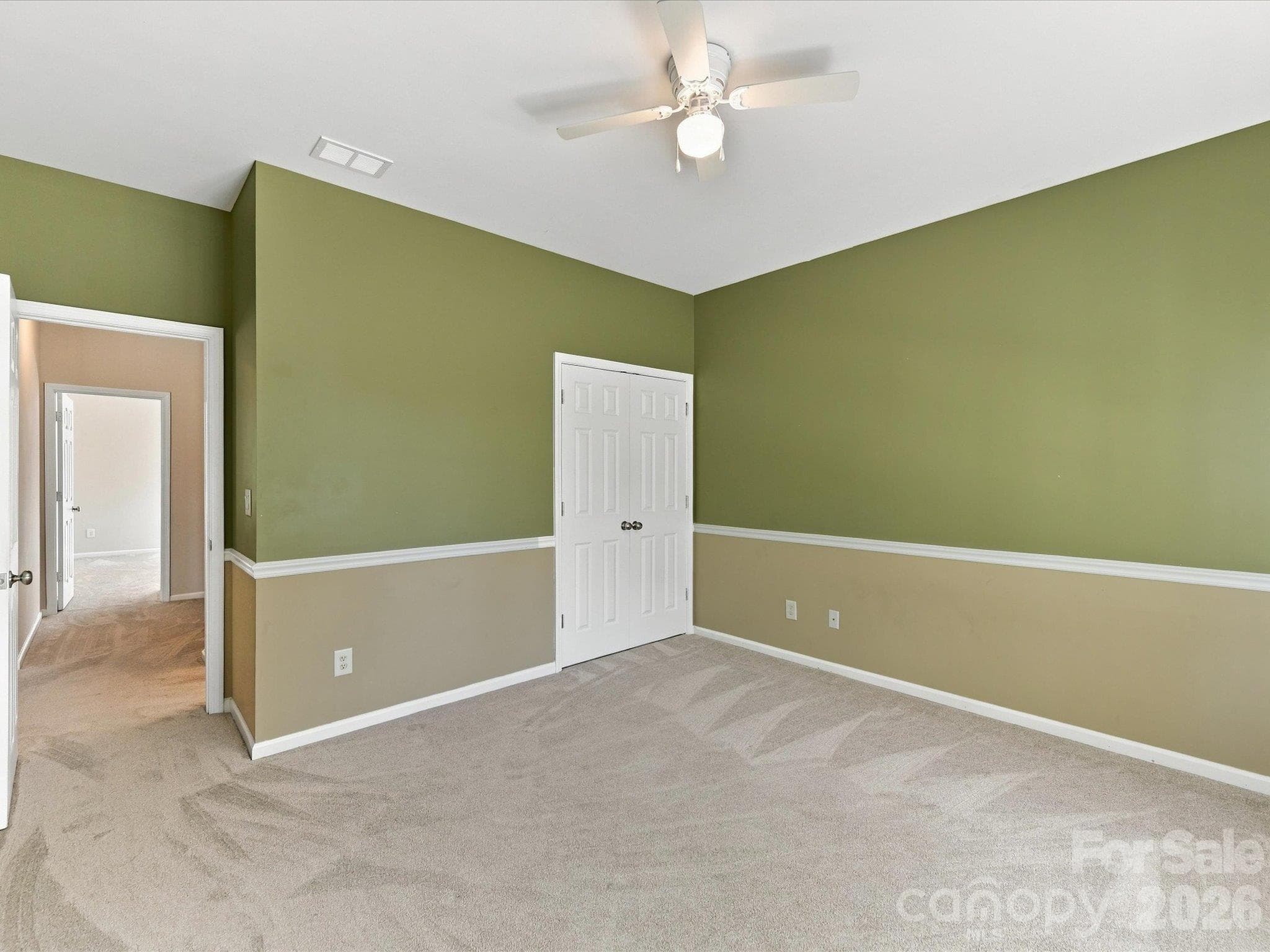 This spacious secondary bedroom offers ample room for furnishings, abundant natural light, and a comfortable layout ideal for family or guests. - 1788 Oakmont Drive, Denver