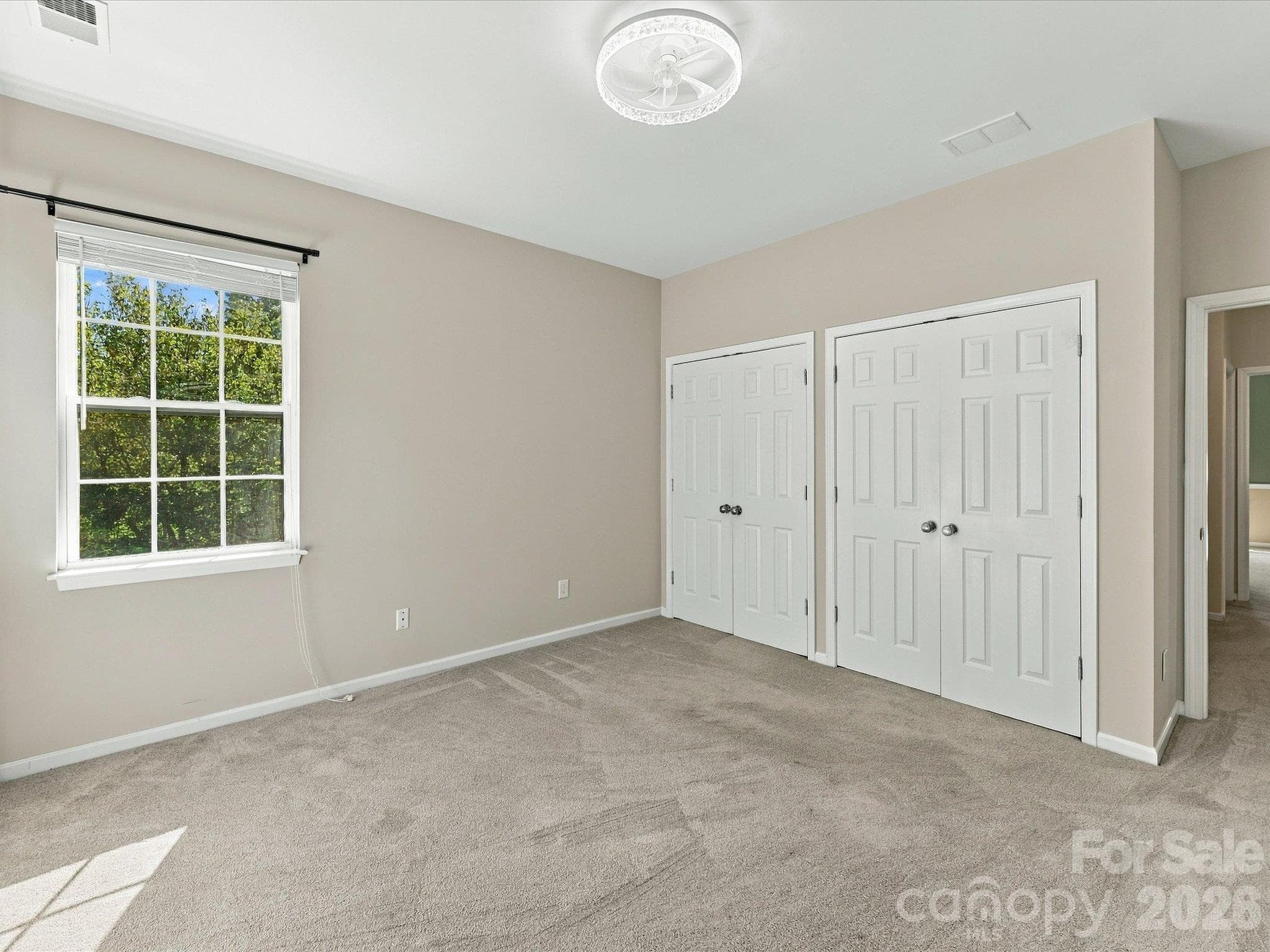 Well-sized bedroom with a flexible layout, abundant natural light, and endless potential to personalize the space to fit your needs. - 1788 Oakmont Drive, Denver