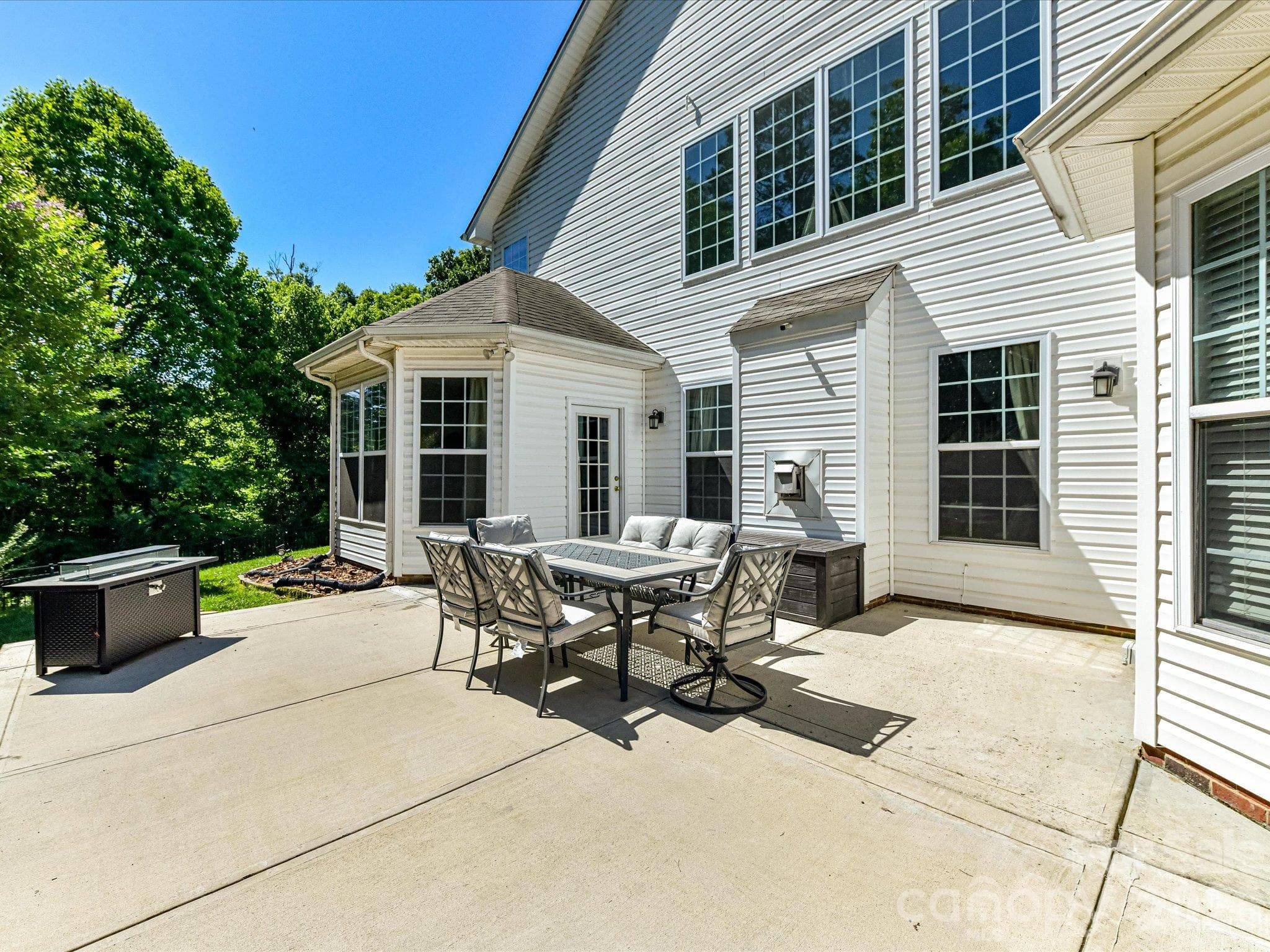 Spacious concrete patio provides the perfect setting for outdoor dining, entertaining, and relaxing while overlooking the private backyard. - 1788 Oakmont Drive, Denver