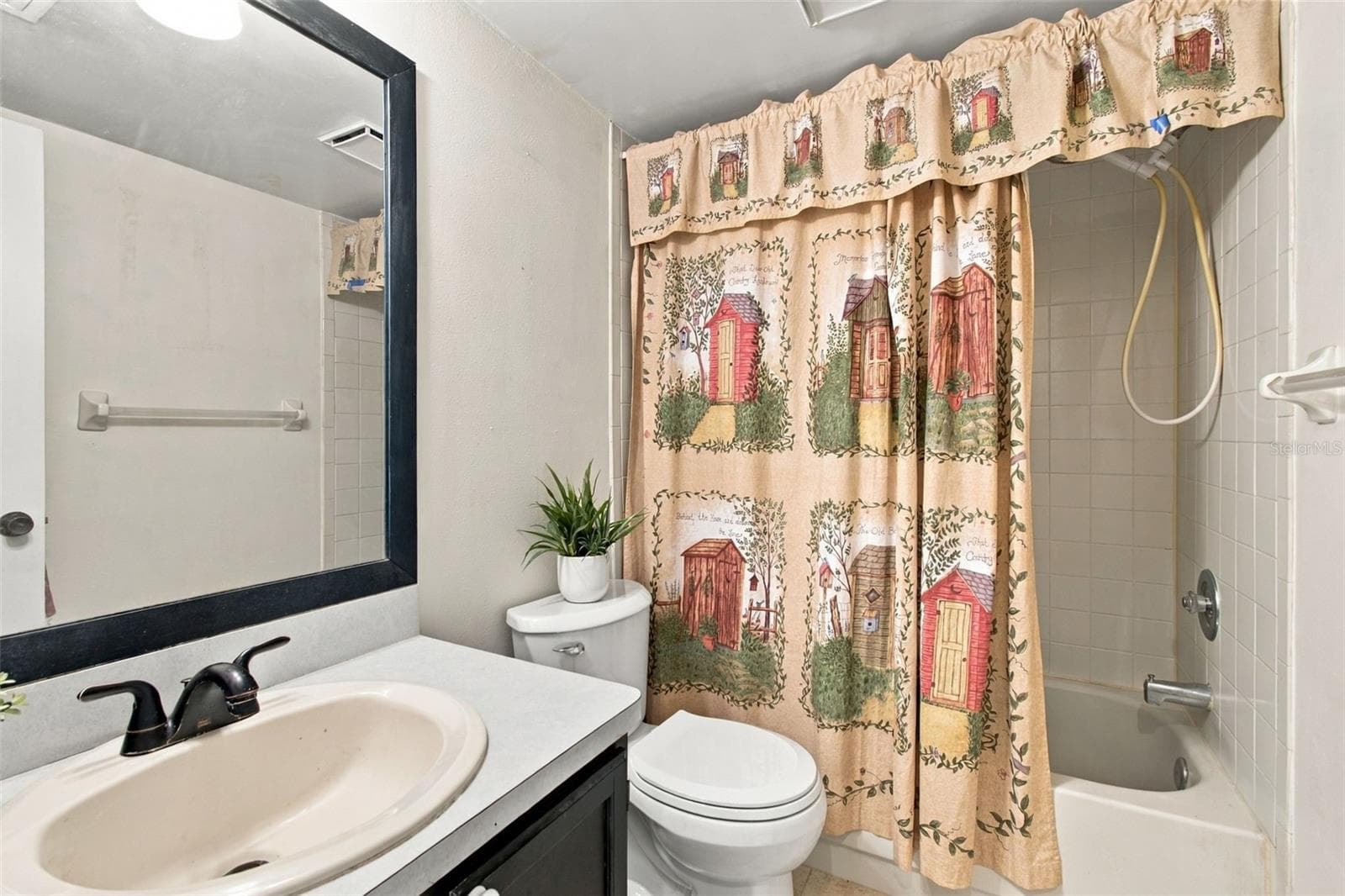 Your primary bathroom is easily accessible from the main living area and your primary bedroom. - 13020 LEVERINGTON ST, TAMPA