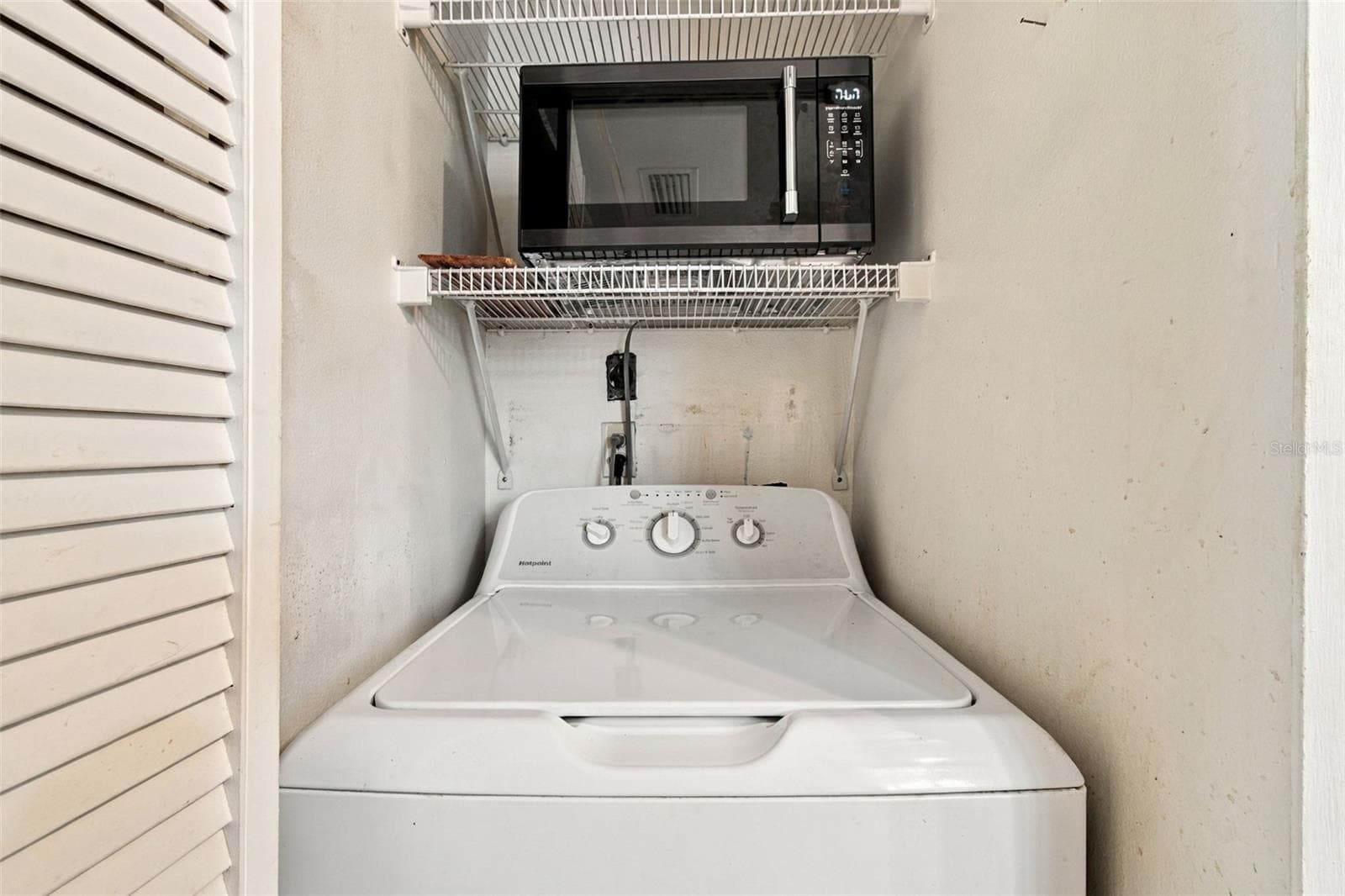 Your laundry room is conveniently located inside your kitchen closet. It does have hook up for a dryer. - 13020 LEVERINGTON ST, TAMPA