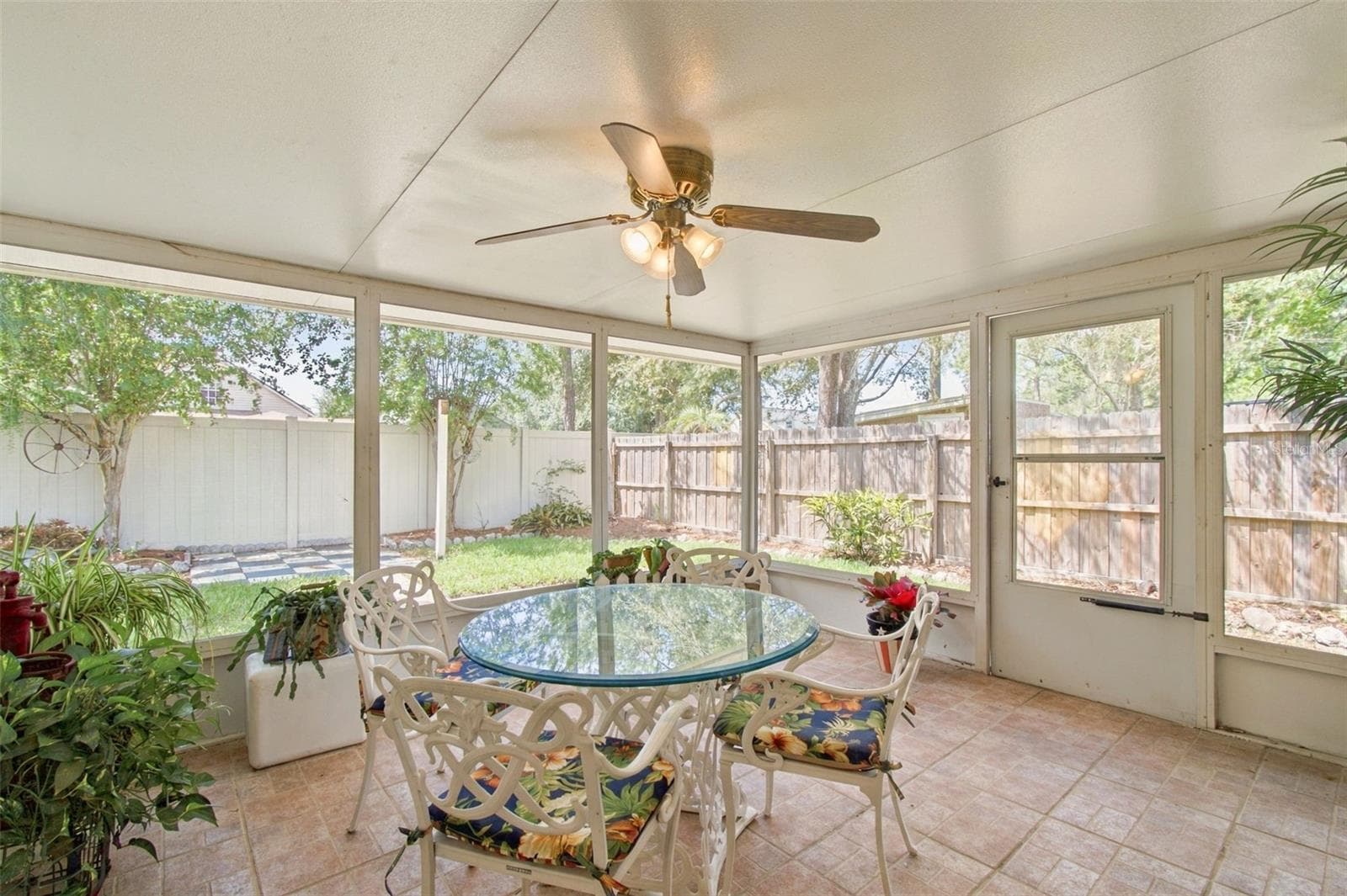 Your covered lanai with tile flooring offers easy to install weather covers to turn this patio into a sunroom. - 13020 LEVERINGTON ST, TAMPA