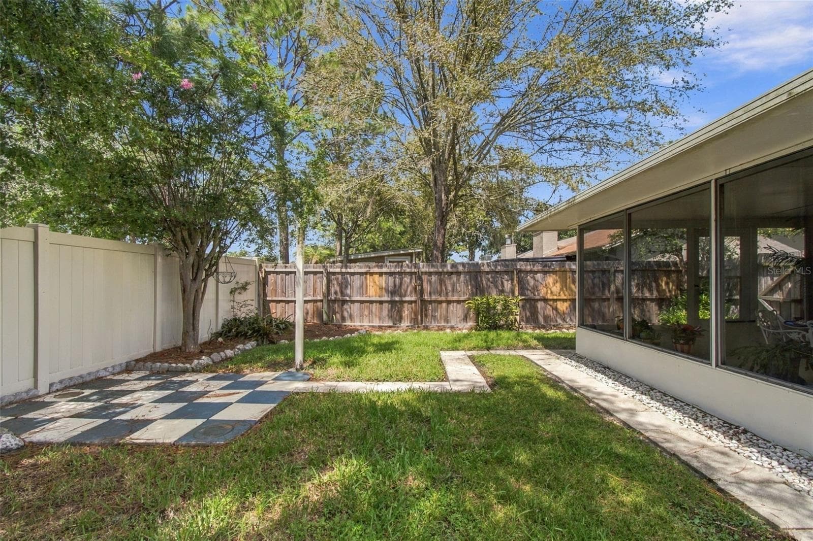 Your backyard is ready for a firepit or grill where you can sit and relax! - 13020 LEVERINGTON ST, TAMPA