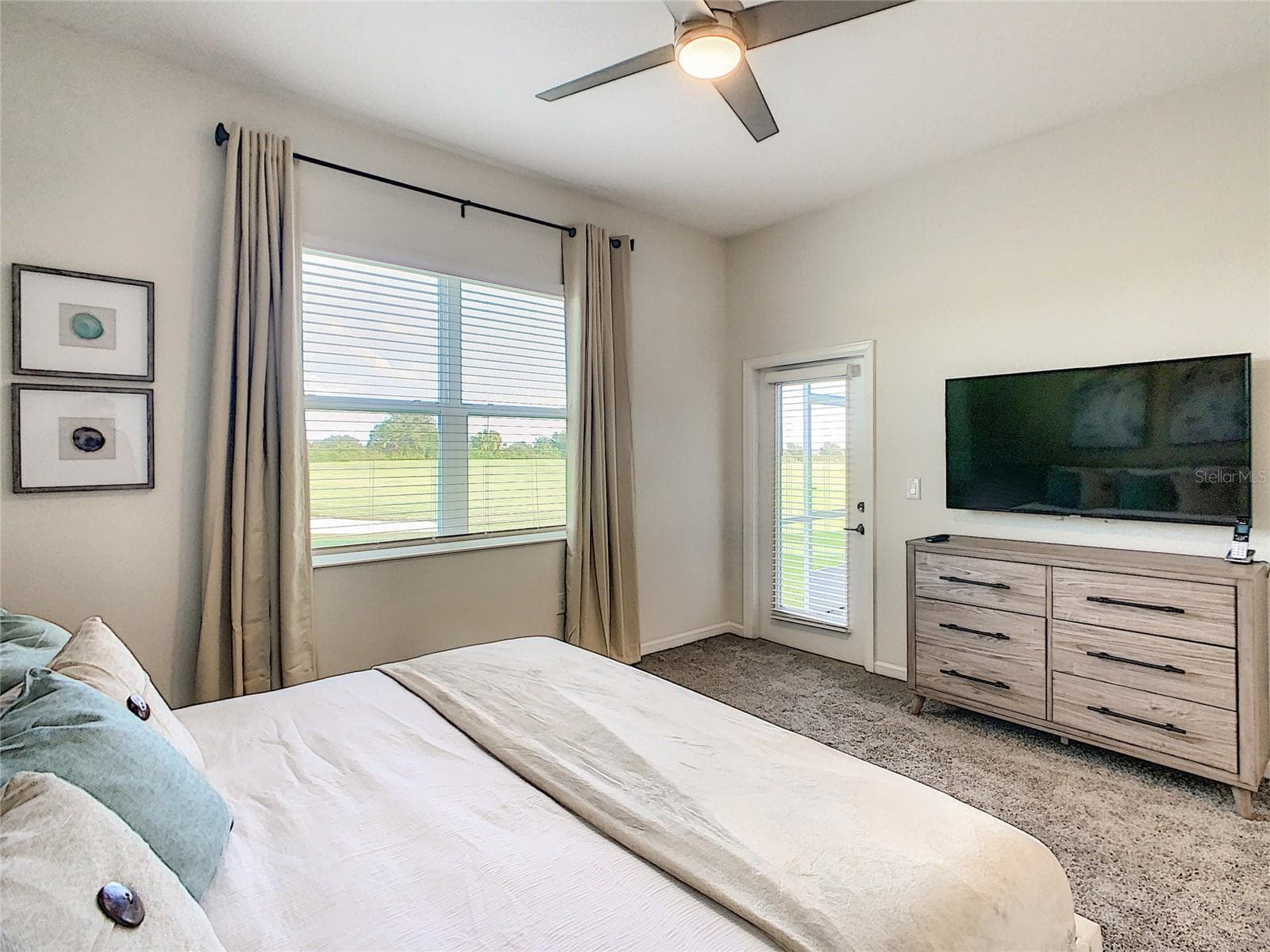 Primary Bedroom TV - 763 OCEAN COURSE AVE., CHAMPIONS GATE