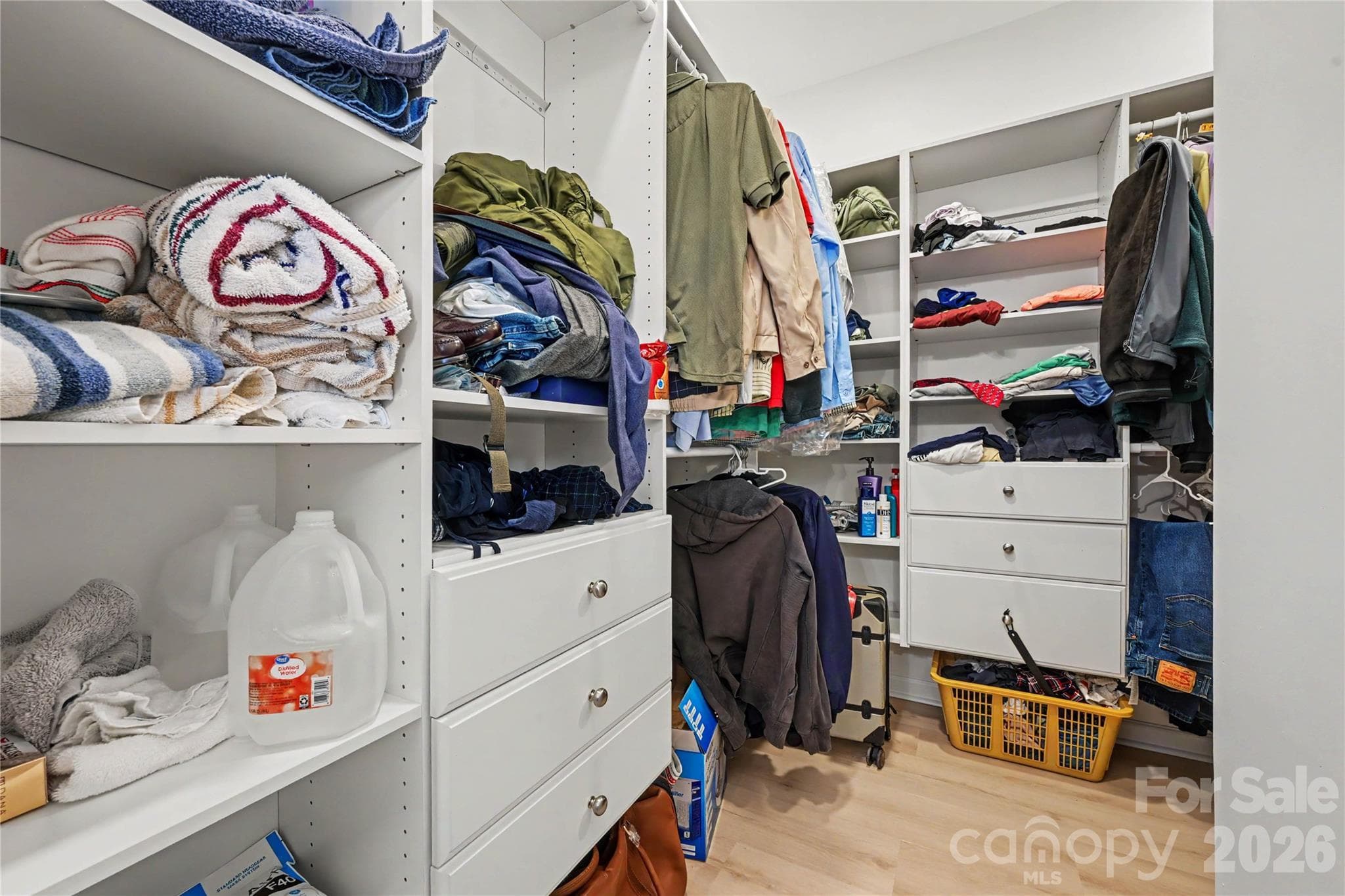 Primary Bedroom Closet off the Bath features Upgraded Closet Organizers and shelves. - 3054 Azalea Drive, Indian Land