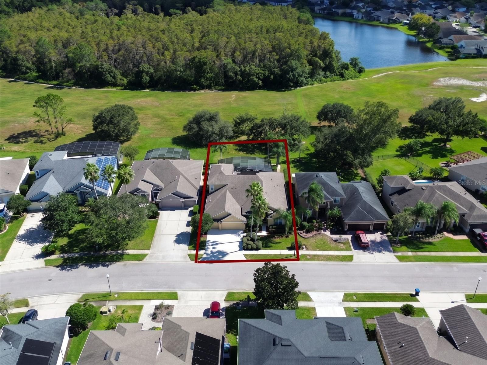 INCREDIBLE AERIAL VIEW OF THIS BEAUTIFUL POOL HOME IN THE DESIRABLE GATED COMMUNITY OF EASTWOOD! Perfectly positioned on a beautifully landscaped lot with NO REAR NEIGHBORS, this exceptional property backs to EXPANSIVE OPEN GREEN SPACE AND A PEACEFUL NATURAL SETTING! Enjoy the privacy and tranquility of your own backyard retreat, surrounded by mature trees, lush landscaping, and picturesque views. A WONDERFUL OPPORTUNITY TO ENJOY FLORIDA LIVING WITH ADDED PRIVACY AND BEAUTIFUL OPEN VIEWS! - 14542 RIVIERA POINTE DR, ORLANDO