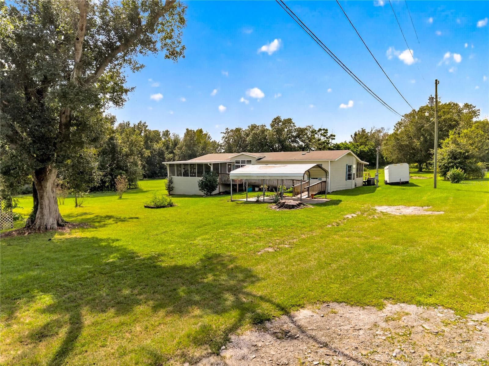Manufactured Home at 8425 HEATHER DR, ZEPHYRHILLS, photo 2 of 38