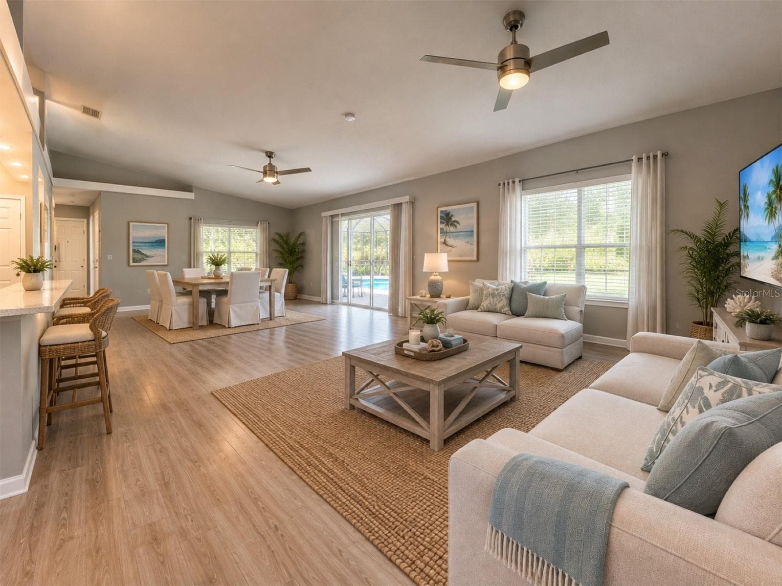 Living Dining room combo overlooking pool - 11705 CHAPELLE CT, CLERMONT