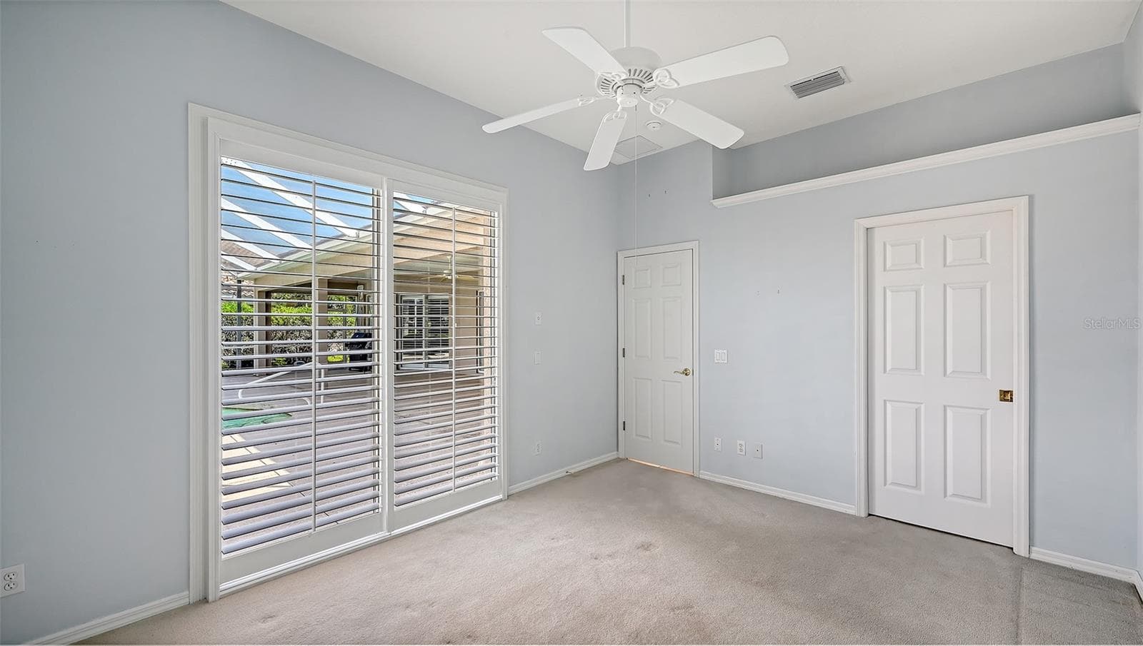Guest Bedroom and pool door - 335 PARK TRACE BLVD, OSPREY