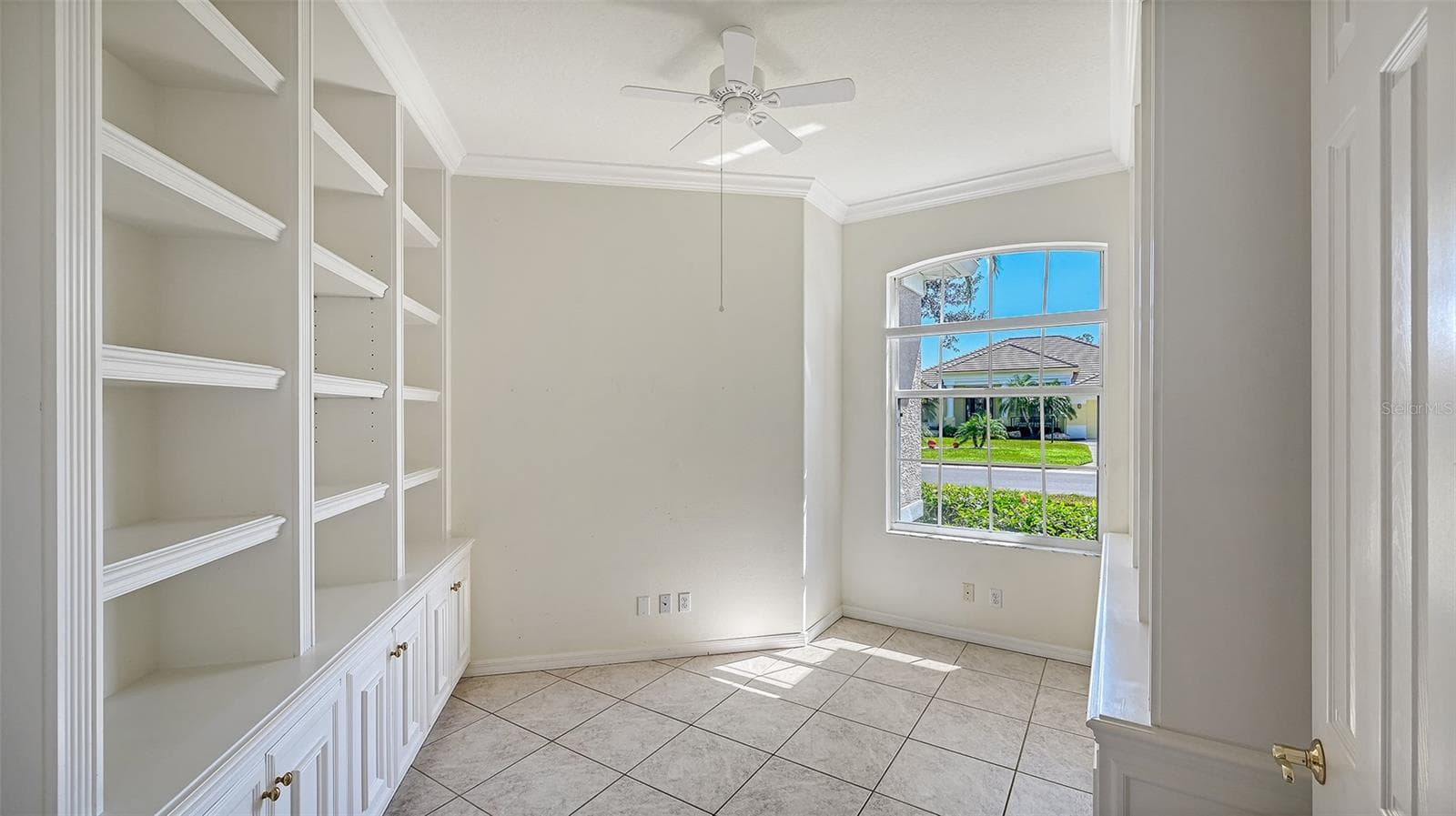 Den with custom Book Cabinets & Shelving - 335 PARK TRACE BLVD, OSPREY