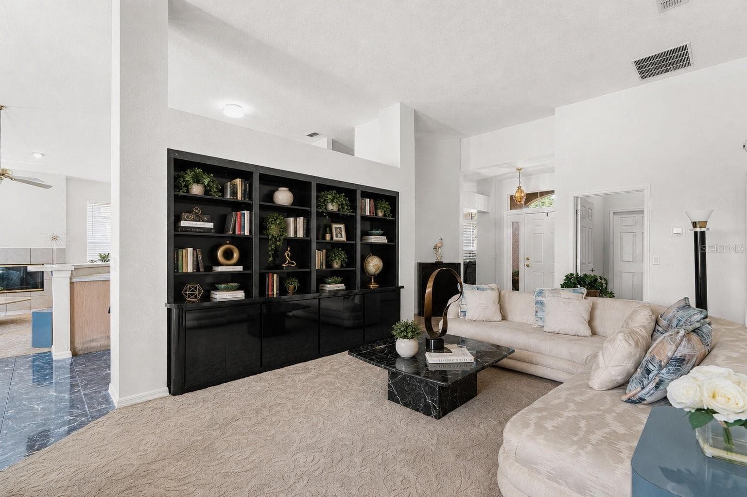 Formal living room with built-in book shelf - 725 TIGRIS LN, LAKE MARY
