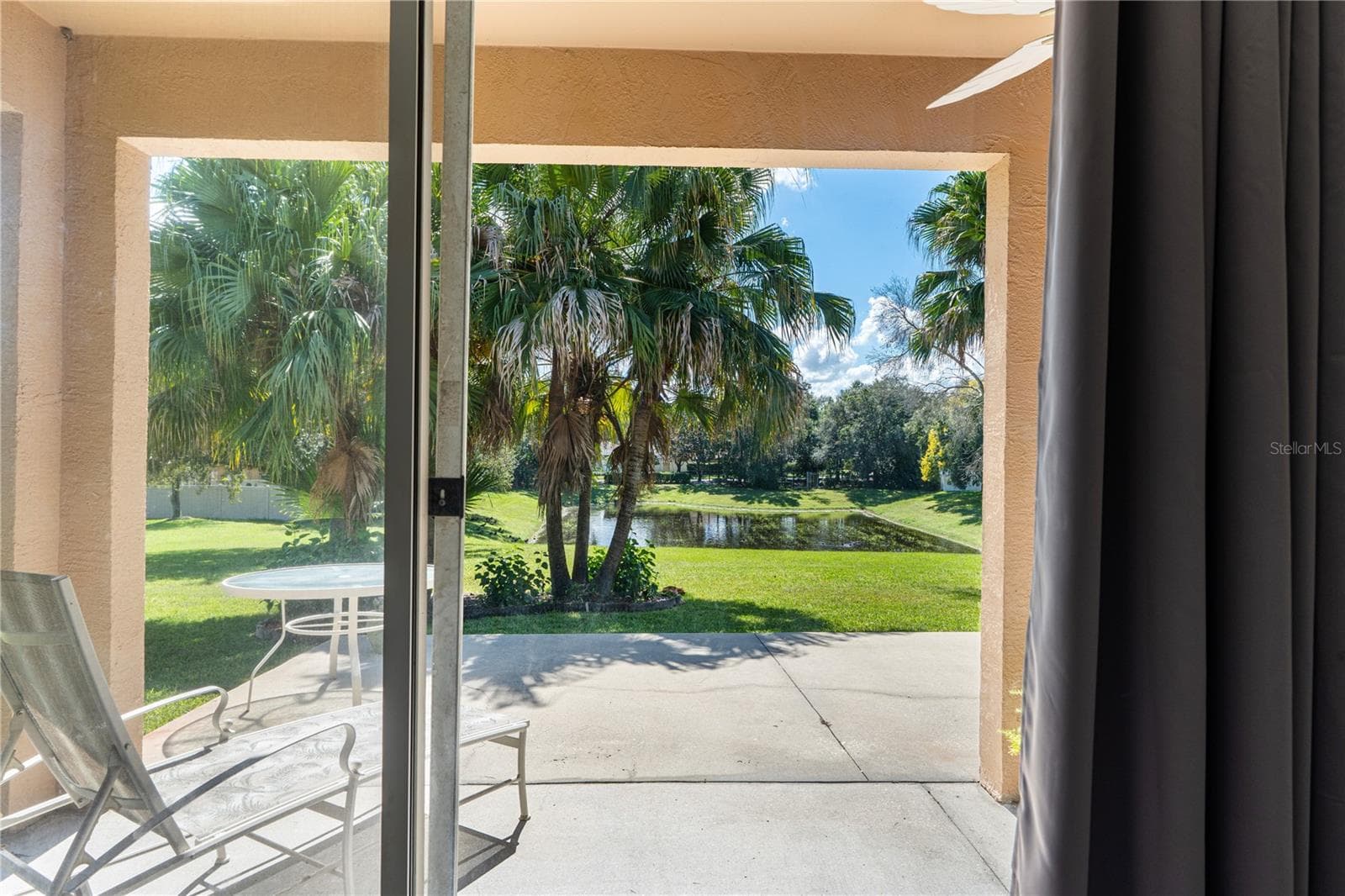 View from primary bedroom sliding glass doors - 725 TIGRIS LN, LAKE MARY