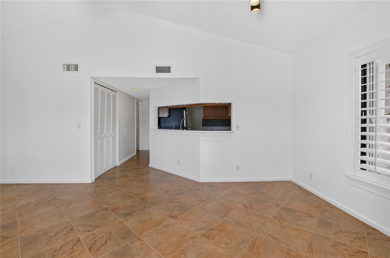 Living Room with Kitchen View - 10 VIA DE CASAS SUR #101, BOYNTON BEACH